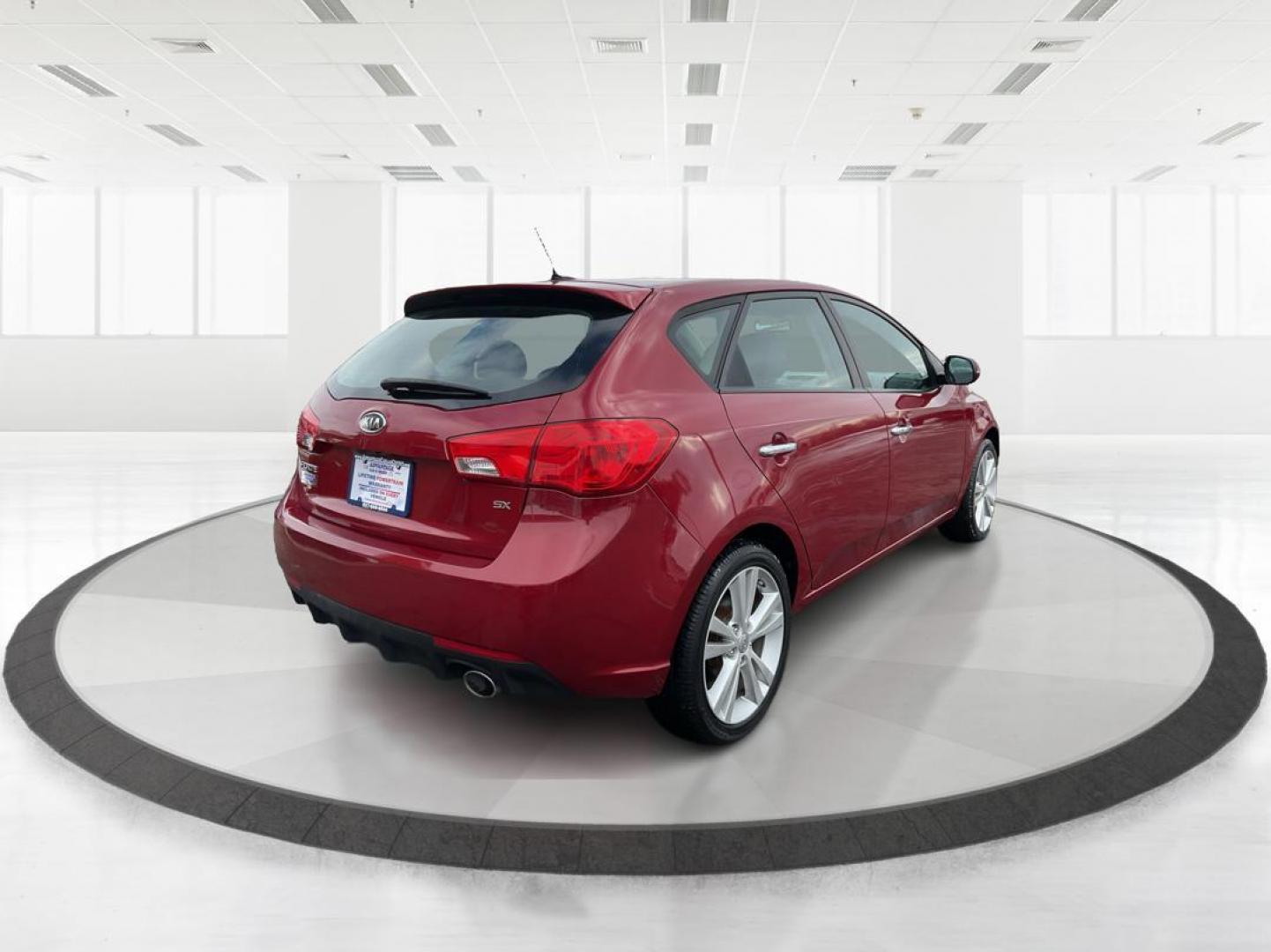 2011 Spicy Red Metallic Kia Forte 5-Door SX (KNAFW5A33B5) with an 2.4L L4 DOHC 16V engine, located at 880 E. National Road, OH, 45377, (937) 908-9800, 39.891918, -84.183975 - Photo#2