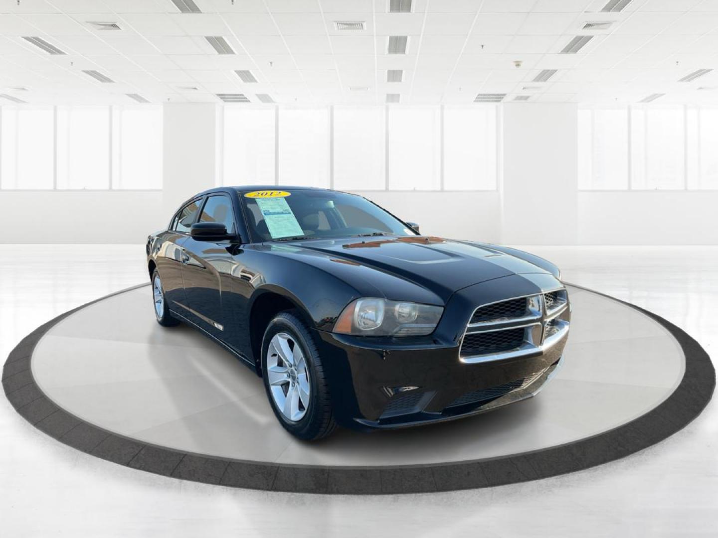 2012 Pitch Black Dodge Charger SE (2C3CDXBGXCH) with an 3.6L V6 DOHC 24V engine, 5-Speed Automatic transmission, located at 401 Woodman Dr, Riverside, OH, 45431, (937) 908-9800, 39.761024, -84.120956 - Photo#0