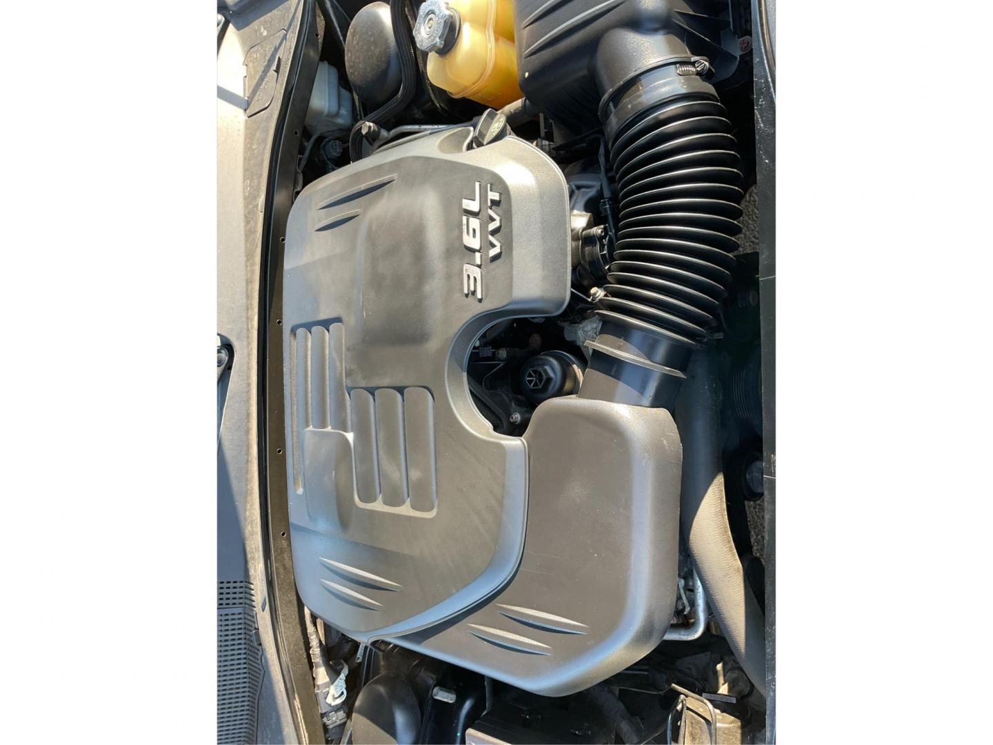 2012 Pitch Black Dodge Charger SE (2C3CDXBGXCH) with an 3.6L V6 DOHC 24V engine, 5-Speed Automatic transmission, located at 401 Woodman Dr, Riverside, OH, 45431, (937) 908-9800, 39.761024, -84.120956 - Photo#10