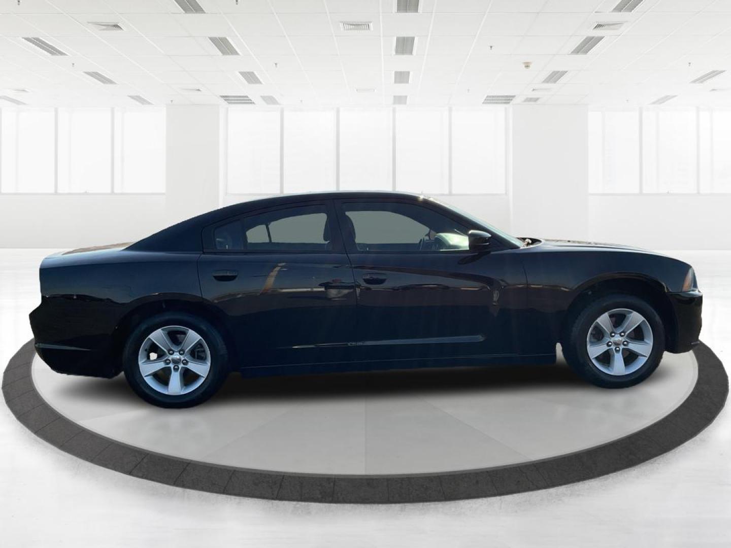 2012 Pitch Black Dodge Charger SE (2C3CDXBGXCH) with an 3.6L V6 DOHC 24V engine, 5-Speed Automatic transmission, located at 401 Woodman Dr, Riverside, OH, 45431, (937) 908-9800, 39.761024, -84.120956 - Photo#1