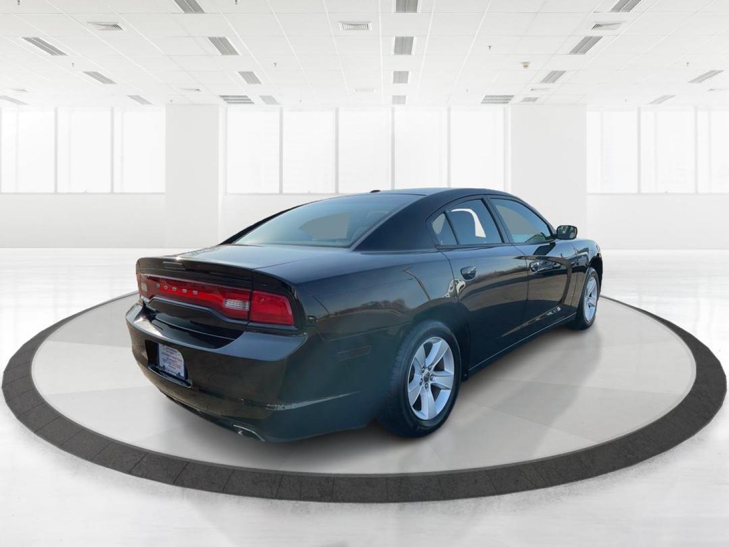2012 Pitch Black Dodge Charger SE (2C3CDXBGXCH) with an 3.6L V6 DOHC 24V engine, 5-Speed Automatic transmission, located at 401 Woodman Dr, Riverside, OH, 45431, (937) 908-9800, 39.761024, -84.120956 - Photo#2