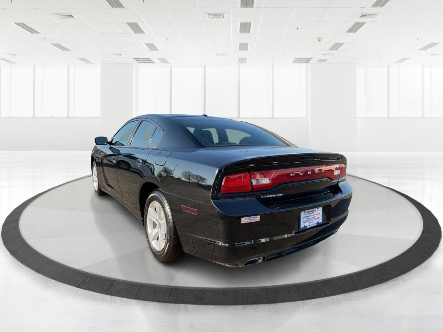 2012 Pitch Black Dodge Charger SE (2C3CDXBGXCH) with an 3.6L V6 DOHC 24V engine, 5-Speed Automatic transmission, located at 401 Woodman Dr, Riverside, OH, 45431, (937) 908-9800, 39.761024, -84.120956 - Photo#4