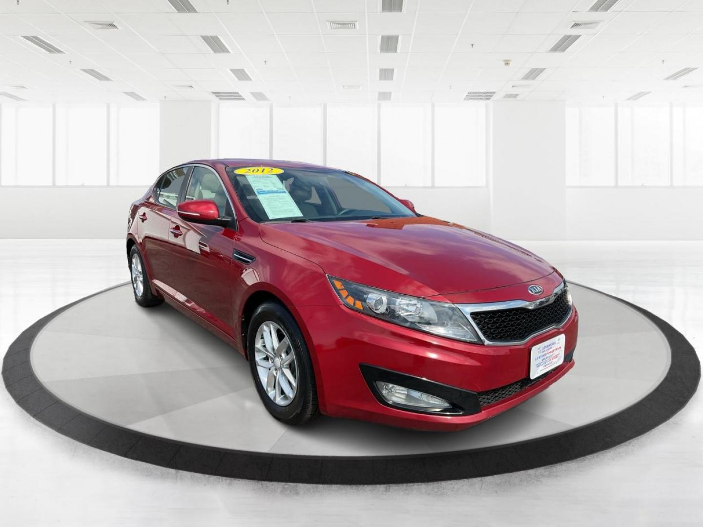 2012 Spicy Red Metallic Kia Optima LX AT (5XXGM4A73CG) with an 2.4L L4 DOHC 16V engine, 6-Speed Automatic transmission, located at 1099 N County Rd 25A , Troy, OH, 45373, (937) 908-9800, 40.057041, -84.215462 - Photo#0