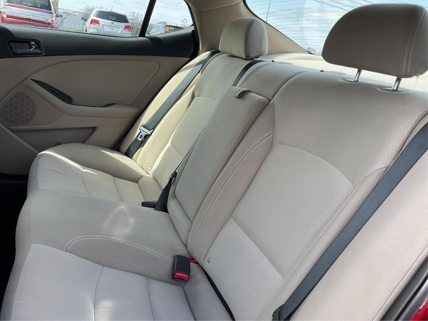 2012 Spicy Red Metallic Kia Optima LX AT (5XXGM4A73CG) with an 2.4L L4 DOHC 16V engine, 6-Speed Automatic transmission, located at 1099 N County Rd 25A , Troy, OH, 45373, (937) 908-9800, 40.057041, -84.215462 - Photo#9