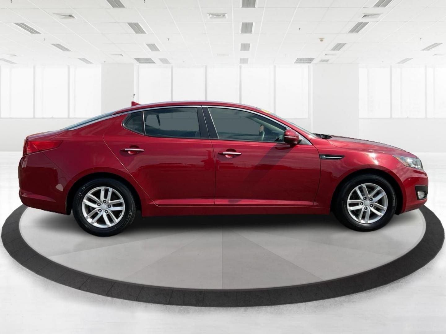 2012 Spicy Red Metallic Kia Optima LX AT (5XXGM4A73CG) with an 2.4L L4 DOHC 16V engine, 6-Speed Automatic transmission, located at 1099 N County Rd 25A , Troy, OH, 45373, (937) 908-9800, 40.057041, -84.215462 - Photo#1