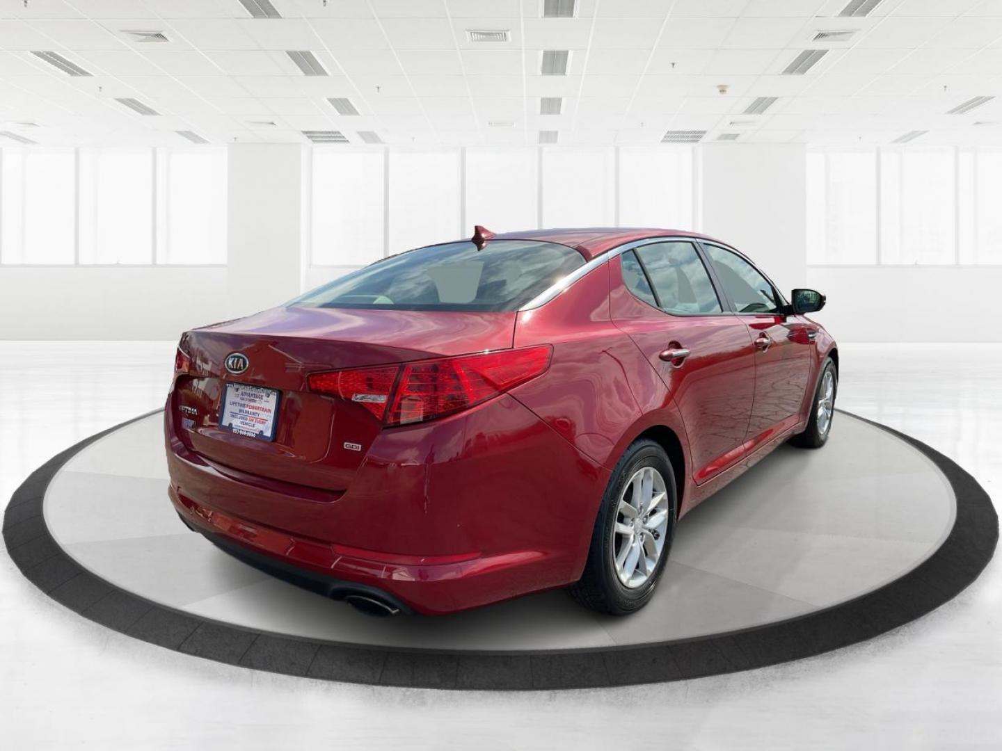 2012 Spicy Red Metallic Kia Optima LX AT (5XXGM4A73CG) with an 2.4L L4 DOHC 16V engine, 6-Speed Automatic transmission, located at 1099 N County Rd 25A , Troy, OH, 45373, (937) 908-9800, 40.057041, -84.215462 - Photo#2