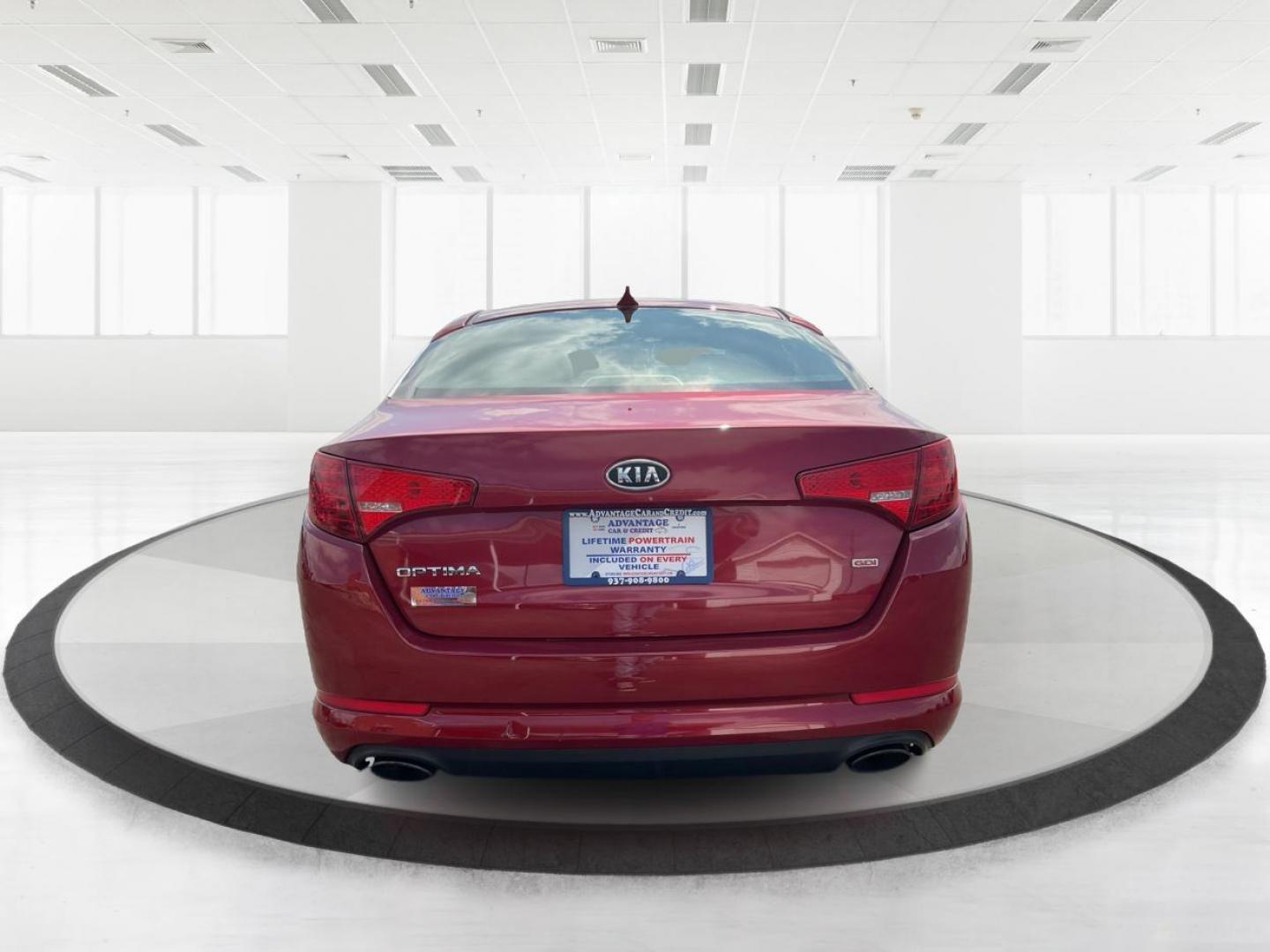 2012 Spicy Red Metallic Kia Optima LX AT (5XXGM4A73CG) with an 2.4L L4 DOHC 16V engine, 6-Speed Automatic transmission, located at 1099 N County Rd 25A , Troy, OH, 45373, (937) 908-9800, 40.057041, -84.215462 - Photo#3