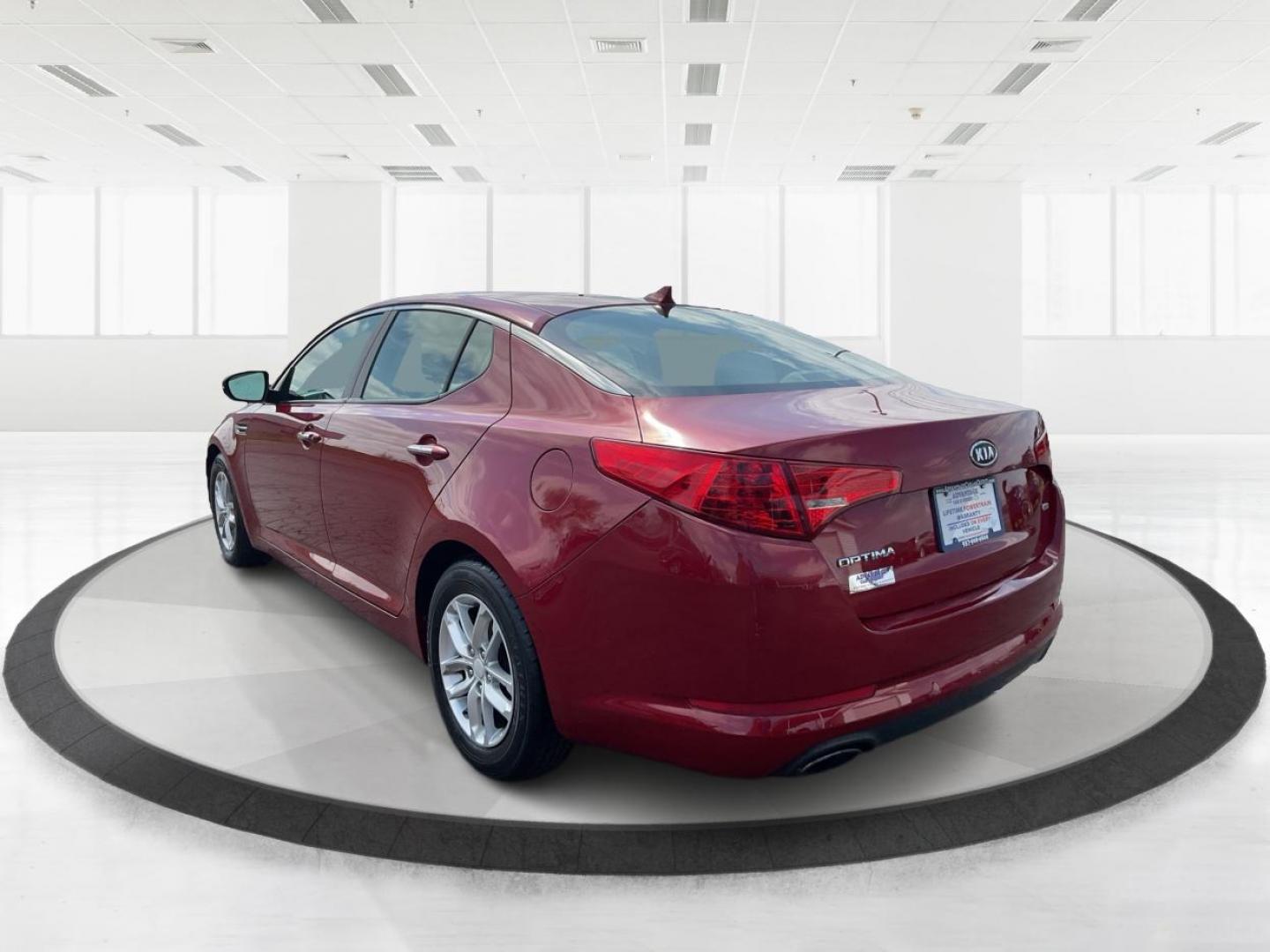 2012 Spicy Red Metallic Kia Optima LX AT (5XXGM4A73CG) with an 2.4L L4 DOHC 16V engine, 6-Speed Automatic transmission, located at 1099 N County Rd 25A , Troy, OH, 45373, (937) 908-9800, 40.057041, -84.215462 - Photo#4