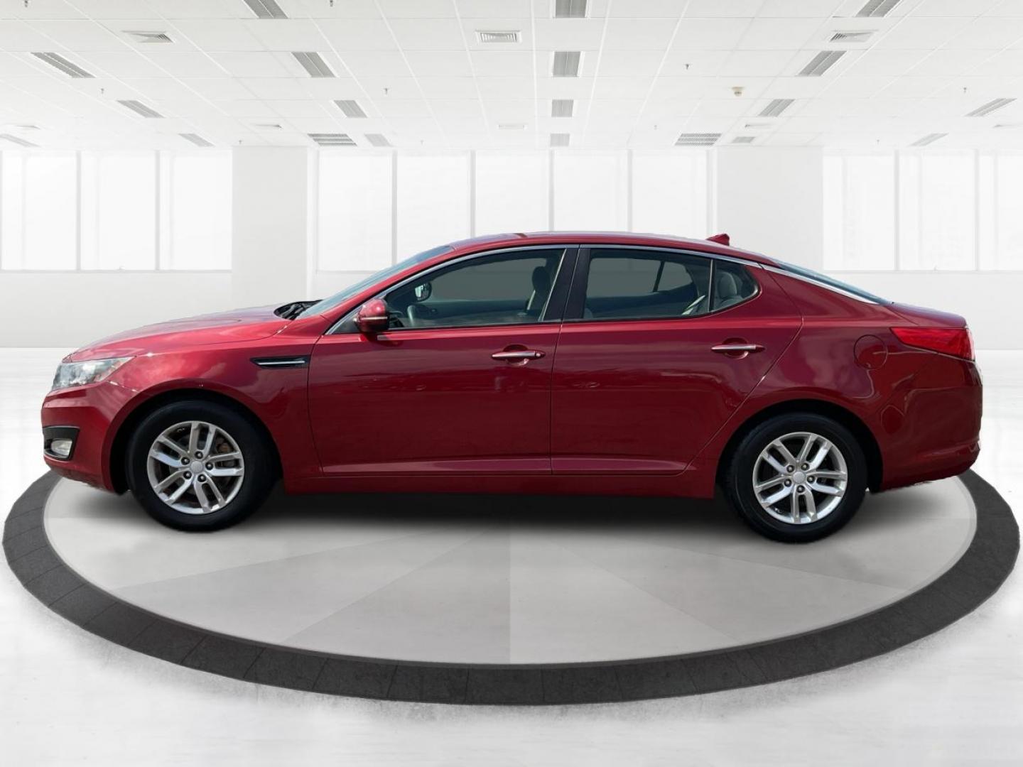 2012 Spicy Red Metallic Kia Optima LX AT (5XXGM4A73CG) with an 2.4L L4 DOHC 16V engine, 6-Speed Automatic transmission, located at 1099 N County Rd 25A , Troy, OH, 45373, (937) 908-9800, 40.057041, -84.215462 - Photo#5