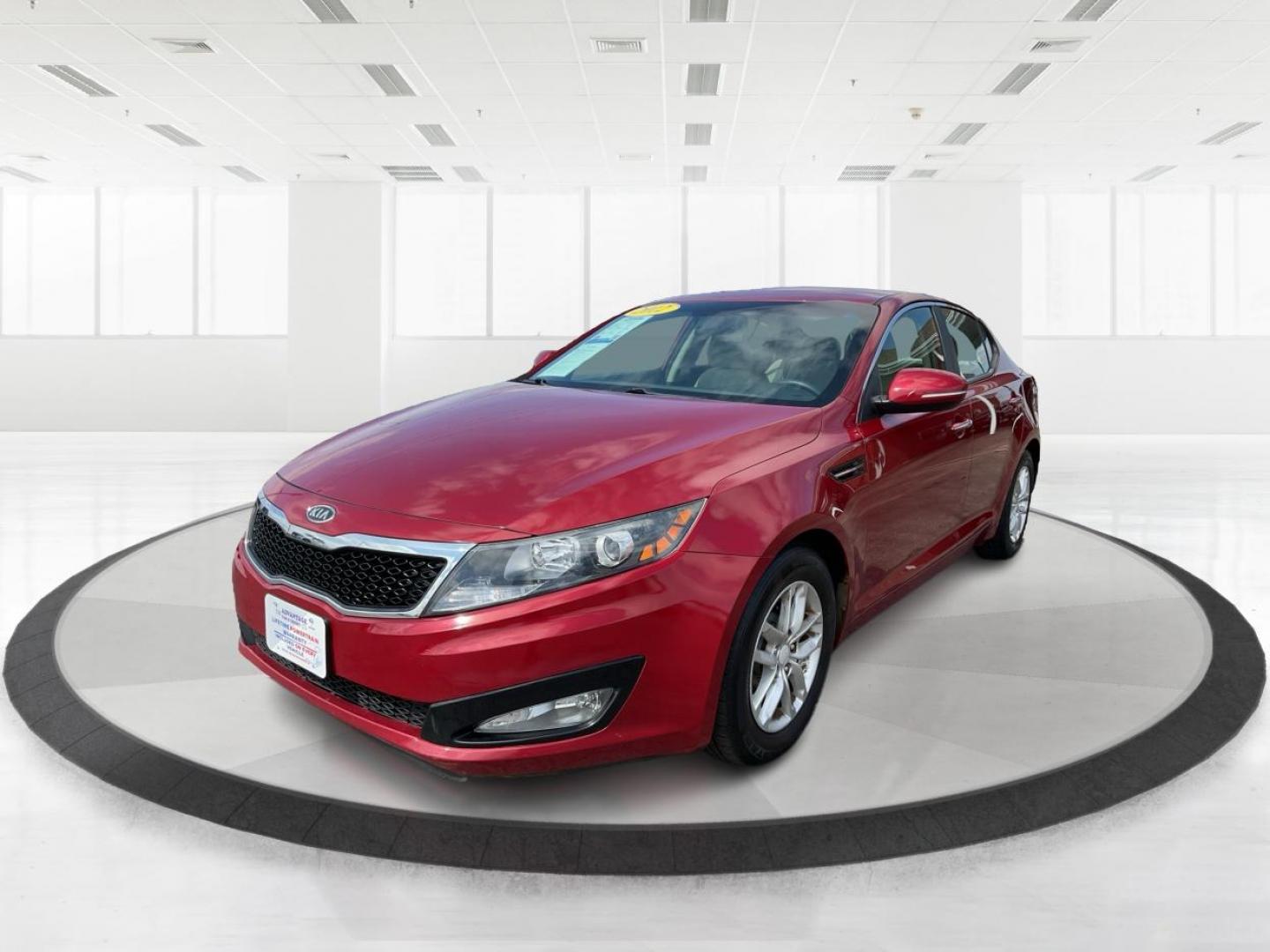 2012 Spicy Red Metallic Kia Optima LX AT (5XXGM4A73CG) with an 2.4L L4 DOHC 16V engine, 6-Speed Automatic transmission, located at 1099 N County Rd 25A , Troy, OH, 45373, (937) 908-9800, 40.057041, -84.215462 - Photo#7