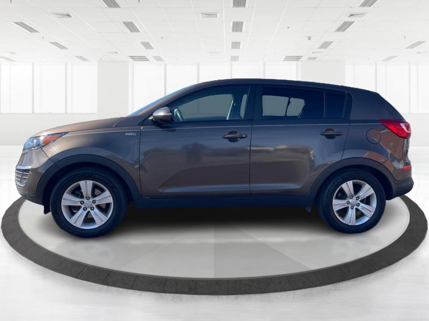 2012 Kia Sportage LX (KNDPBCA20C7) with an 2.4L I-4 DOHC engine, located at 401 Woodman Dr, Riverside, OH, 45431, (937) 908-9800, 39.761024, -84.120956 - Photo#5