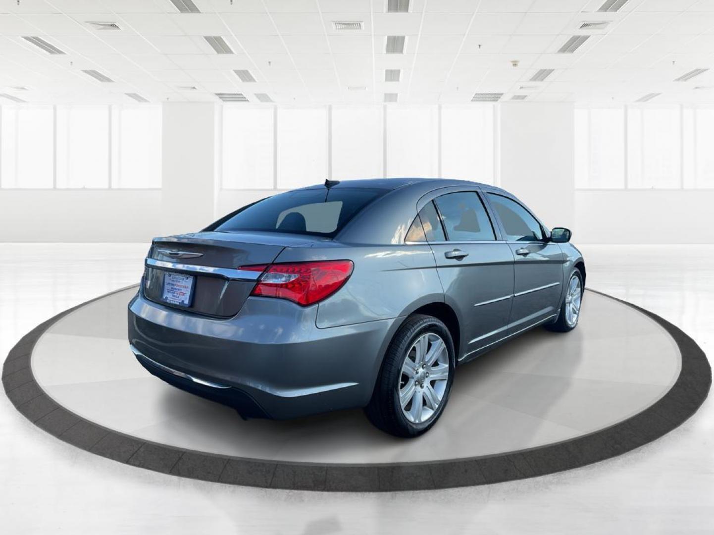 2013 Chrysler 200 Touring (1C3CCBBG0DN) with an 2.4L I-4 DOHC engine, located at 401 Woodman Dr, Riverside, OH, 45431, (937) 908-9800, 39.761024, -84.120956 - Photo#2
