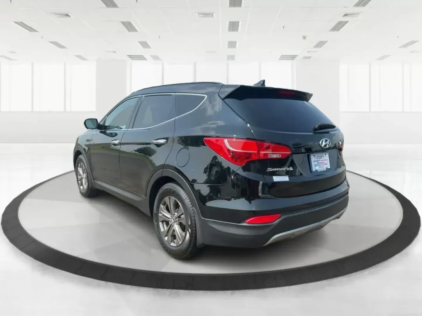 2013 Twilight Black Hyundai Santa Fe Sport 2.4 AWD (5XYZUDLB5DG) with an 2.4L L4 DOHC 16V engine, 6-Speed Automatic transmission, located at 1184 Kauffman Ave, Fairborn, OH, 45324, (937) 908-9800, 39.807072, -84.031563 - Photo#4