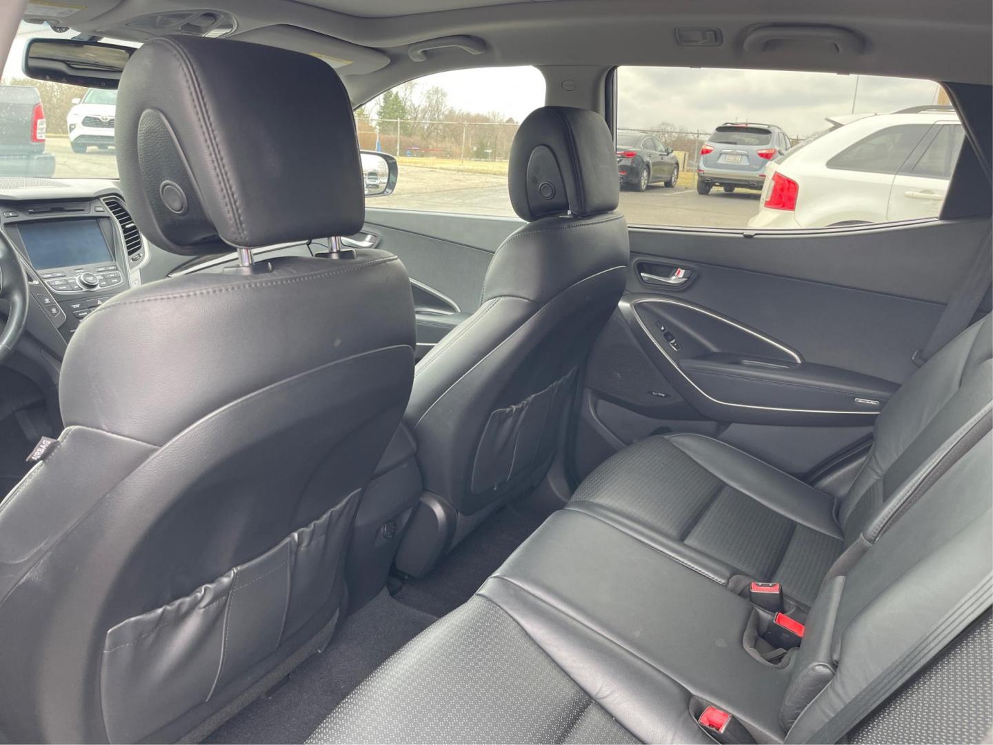 2013 Hyundai Santa Fe Sport 2.0T (5XYZW3LA3DG) with an Theta II 2L I-4 gasoline direct injection engine, located at 401 Woodman Dr, Riverside, OH, 45431, (937) 908-9800, 39.761024, -84.120956 - Photo#9