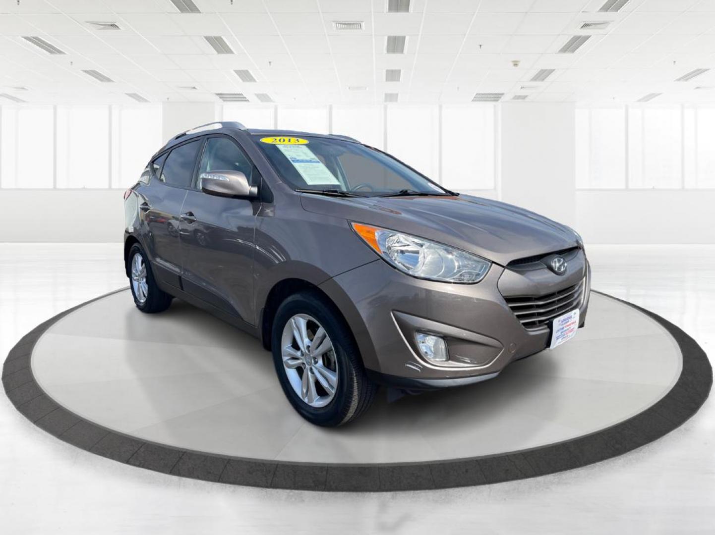 2013 Hyundai Tucson GLS (KM8JU3AC1DU) with an Theta II 2.4L I-4 DOHC engine, located at 1099 N County Rd 25A , Troy, OH, 45373, (937) 908-9800, 40.057041, -84.215462 - Photo#0