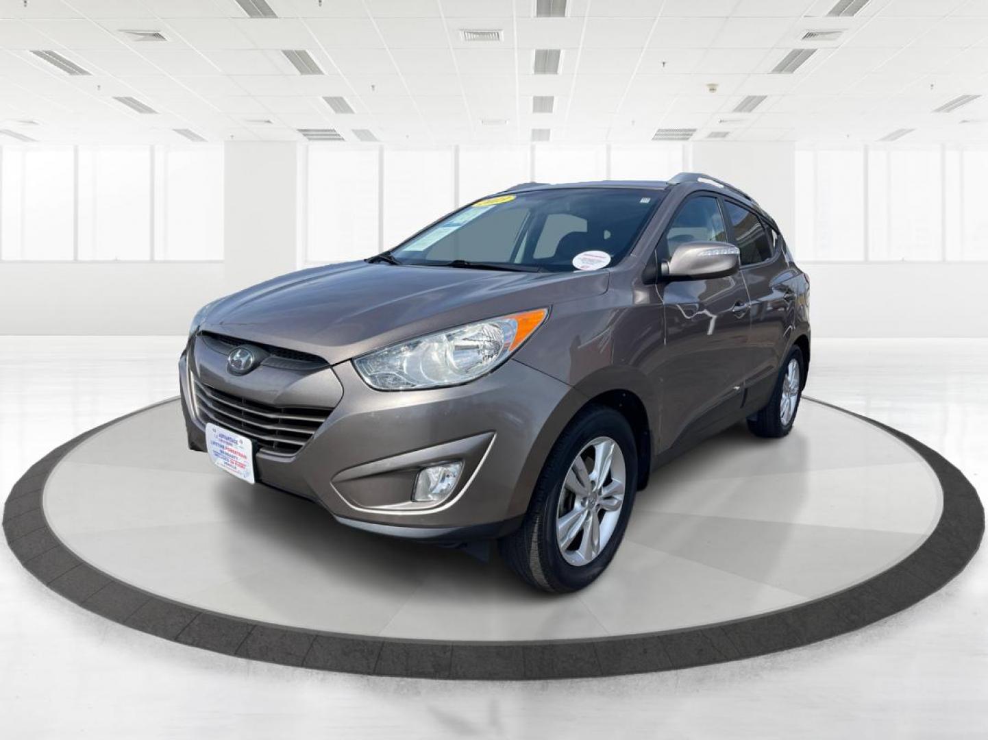 2013 Hyundai Tucson GLS (KM8JU3AC1DU) with an Theta II 2.4L I-4 DOHC engine, located at 1099 N County Rd 25A , Troy, OH, 45373, (937) 908-9800, 40.057041, -84.215462 - Photo#7