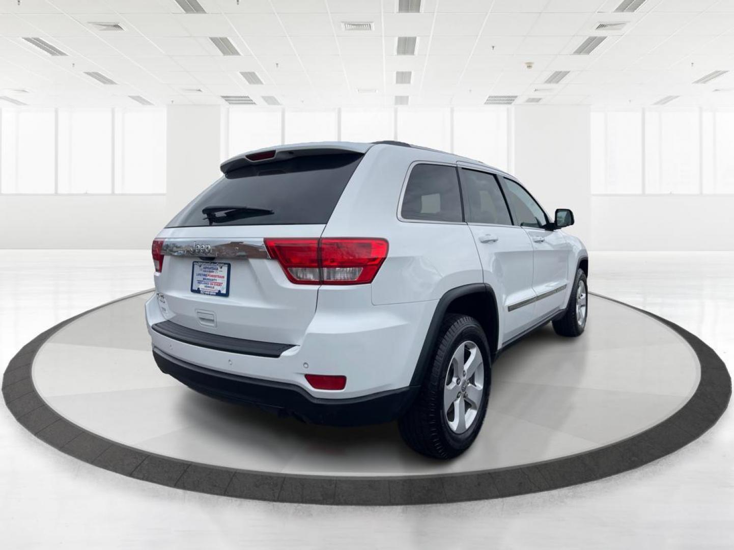 2013 Jeep Grand Cherokee Laredo (1C4RJFAG8DC) with an 3.6L V-6 DOHC engine, located at 1951 S Dayton Lakeview Rd., New Carlisle, OH, 45344, (937) 908-9800, 39.890999, -84.050255 - Photo#2