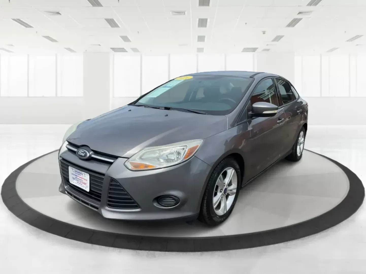 2014 Ford Focus SE (1FADP3F21EL) with an 2L I-4 gasoline direct injection engine, located at 1099 N County Rd 25A , Troy, OH, 45373, (937) 908-9800, 40.057041, -84.215462 - Photo#7