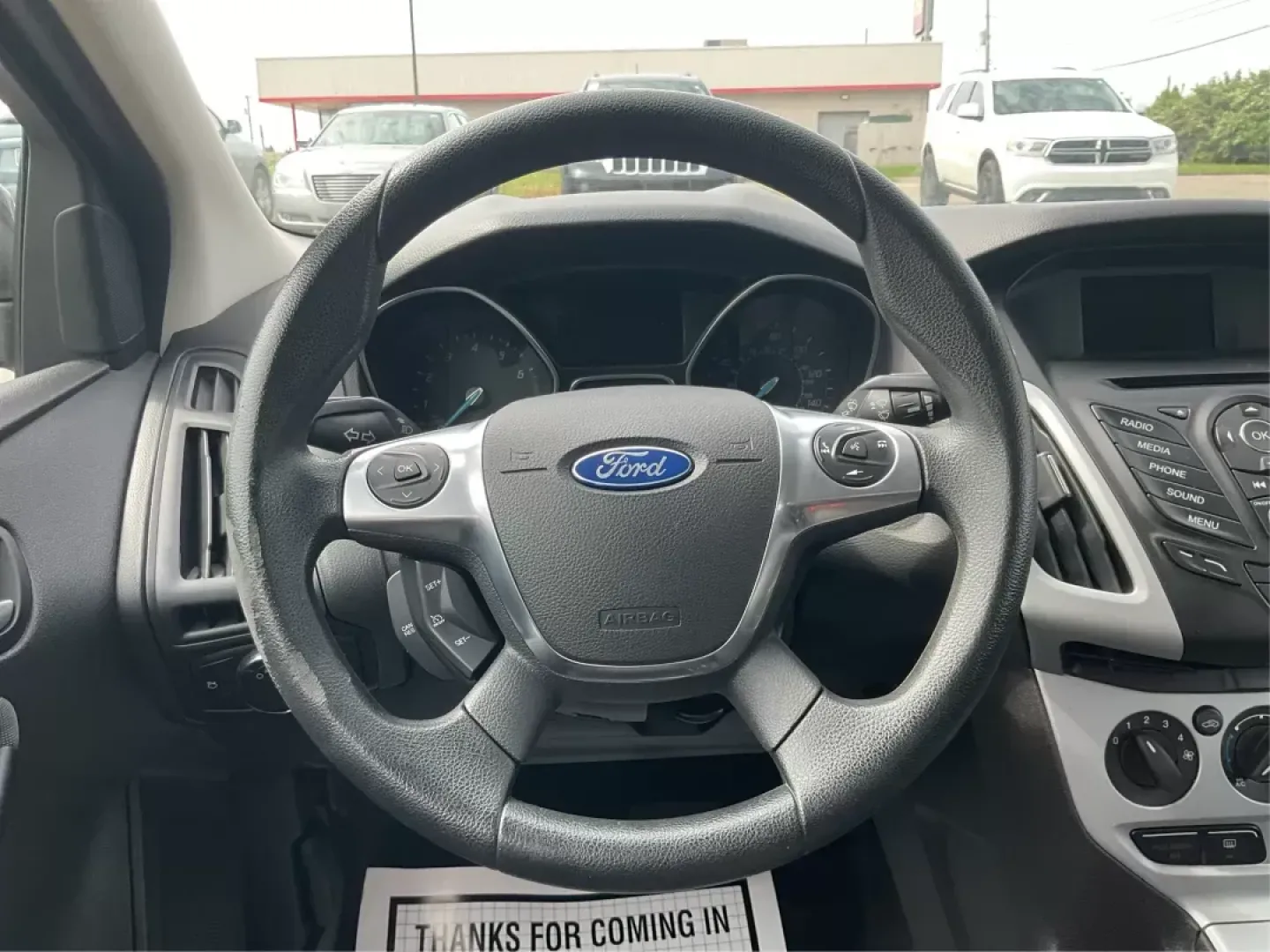 2014 Ford Focus SE (1FADP3F21EL) with an 2L I-4 gasoline direct injection engine, located at 1099 N County Rd 25A , Troy, OH, 45373, (937) 908-9800, 40.057041, -84.215462 - Photo#15