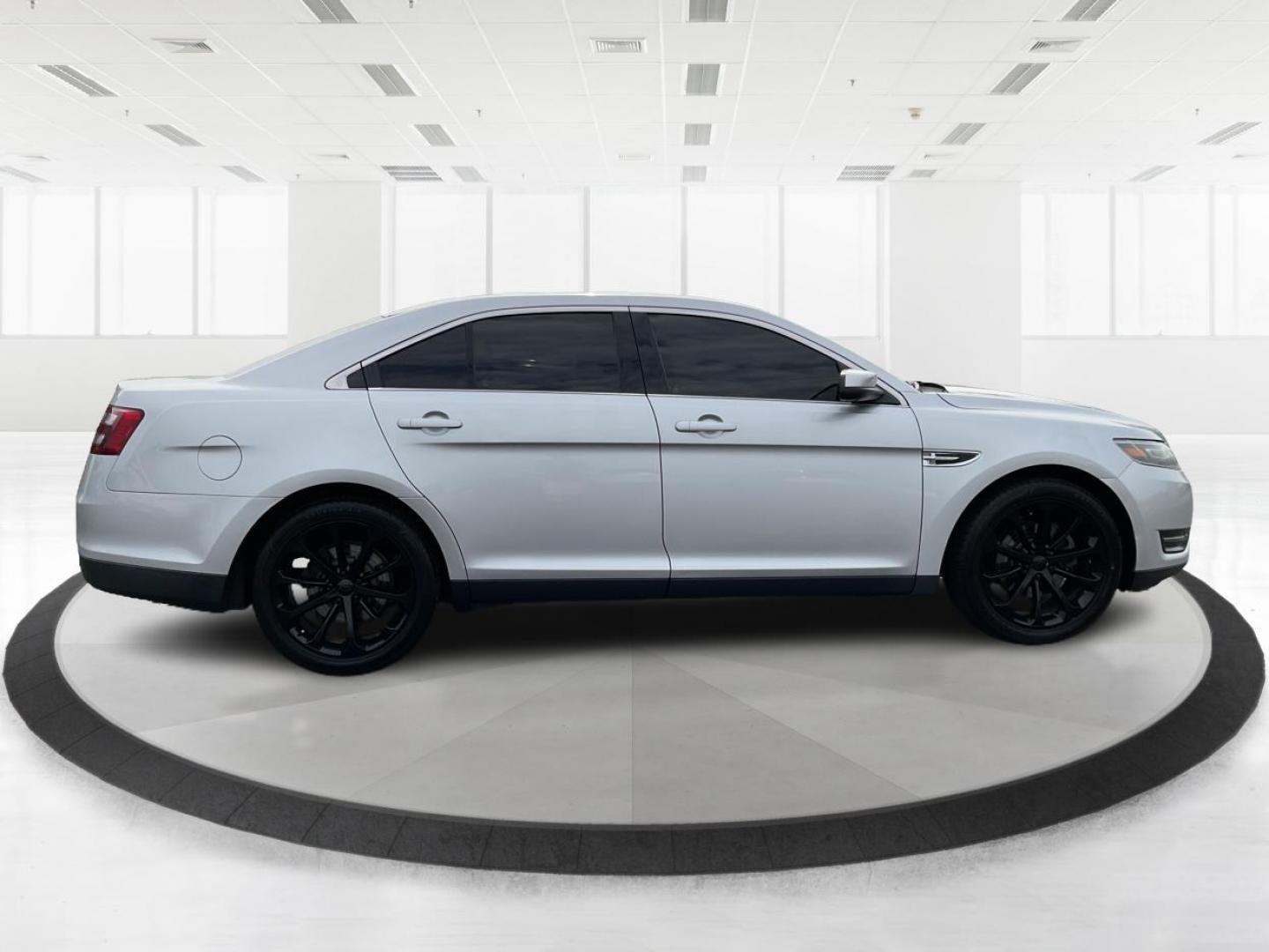 2014 Ford Taurus SEL (1FAHP2E86EG) with an EcoBoost 2L I-4 gasoline direct injection engine, located at 1099 N County Rd 25A , Troy, OH, 45373, (937) 908-9800, 40.057041, -84.215462 - Photo#1