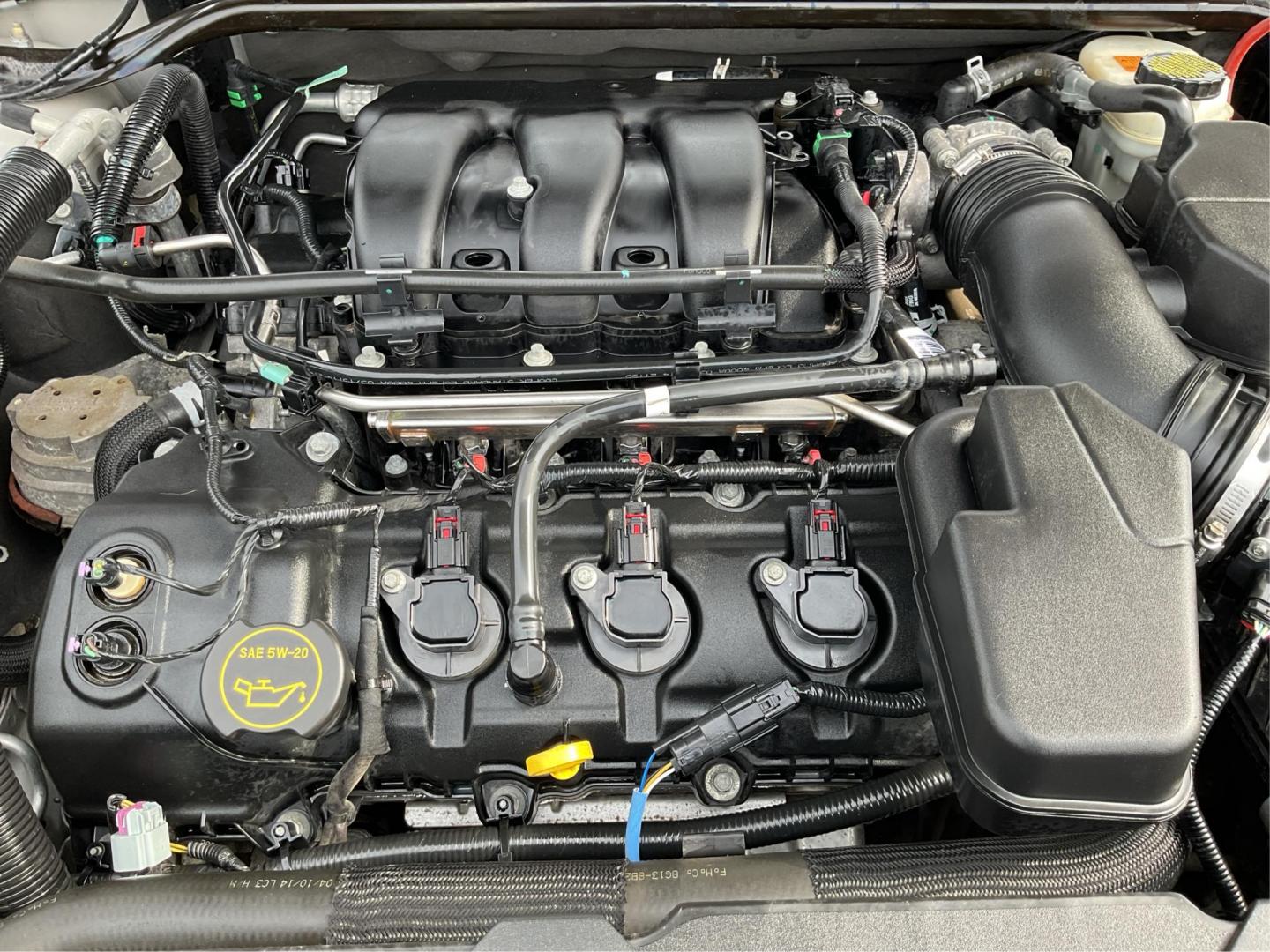 2014 Ford Taurus SEL (1FAHP2E86EG) with an EcoBoost 2L I-4 gasoline direct injection engine, located at 1099 N County Rd 25A , Troy, OH, 45373, (937) 908-9800, 40.057041, -84.215462 - Photo#11