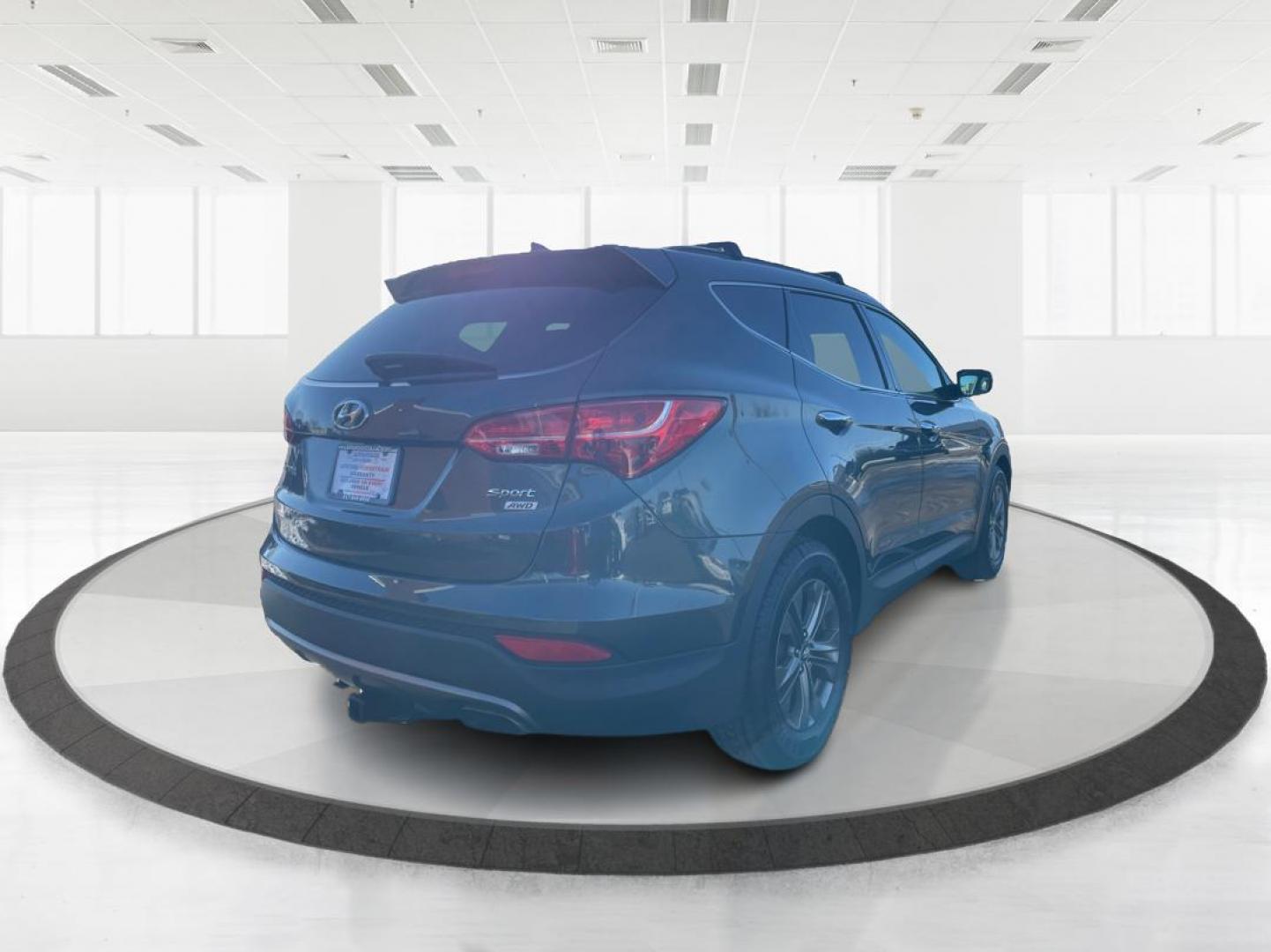 2014 Hyundai Santa Fe Sport 2.4 AWD (5XYZUDLB2EG) with an 2.4L L4 DOHC 16V engine, 6-Speed Automatic transmission, located at 1951 S Dayton Lakeview Rd., New Carlisle, OH, 45344, (937) 908-9800, 39.890999, -84.050255 - Photo#2