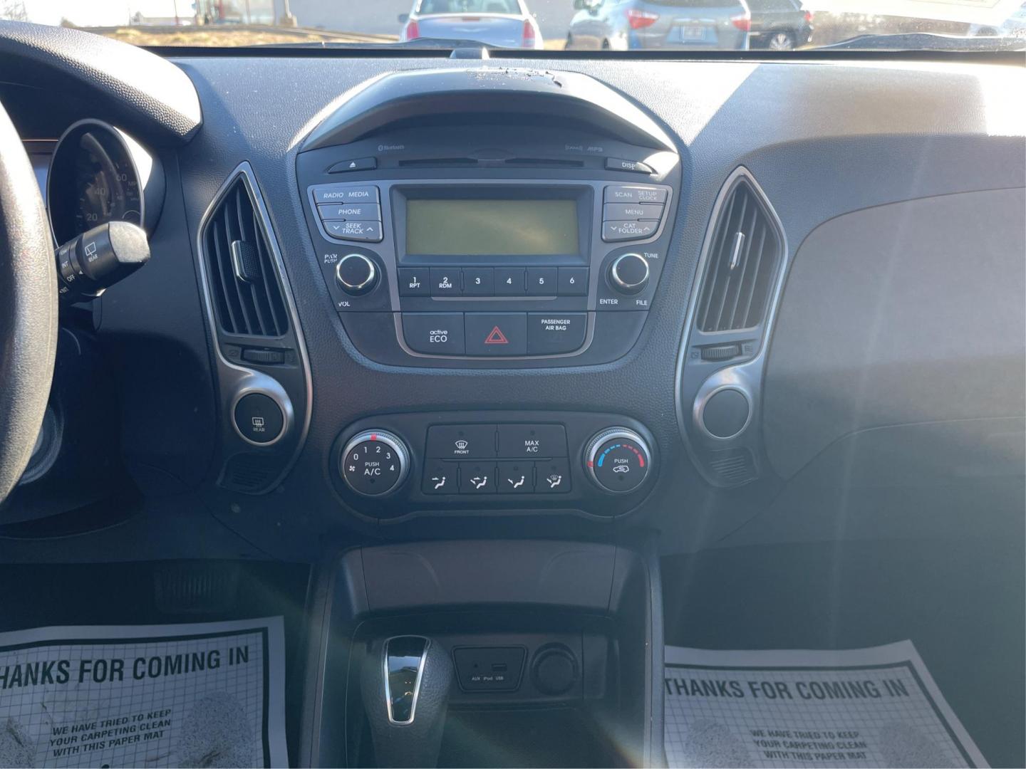 2014 Black Hyundai Tucson GL Auto AWD (KM8JTCAF0EU) with an 2.0L L4 DOHC 16V engine, 6-Speed Automatic transmission, located at 880 E. National Road, OH, 45377, (937) 908-9800, 39.891918, -84.183975 - Photo#12