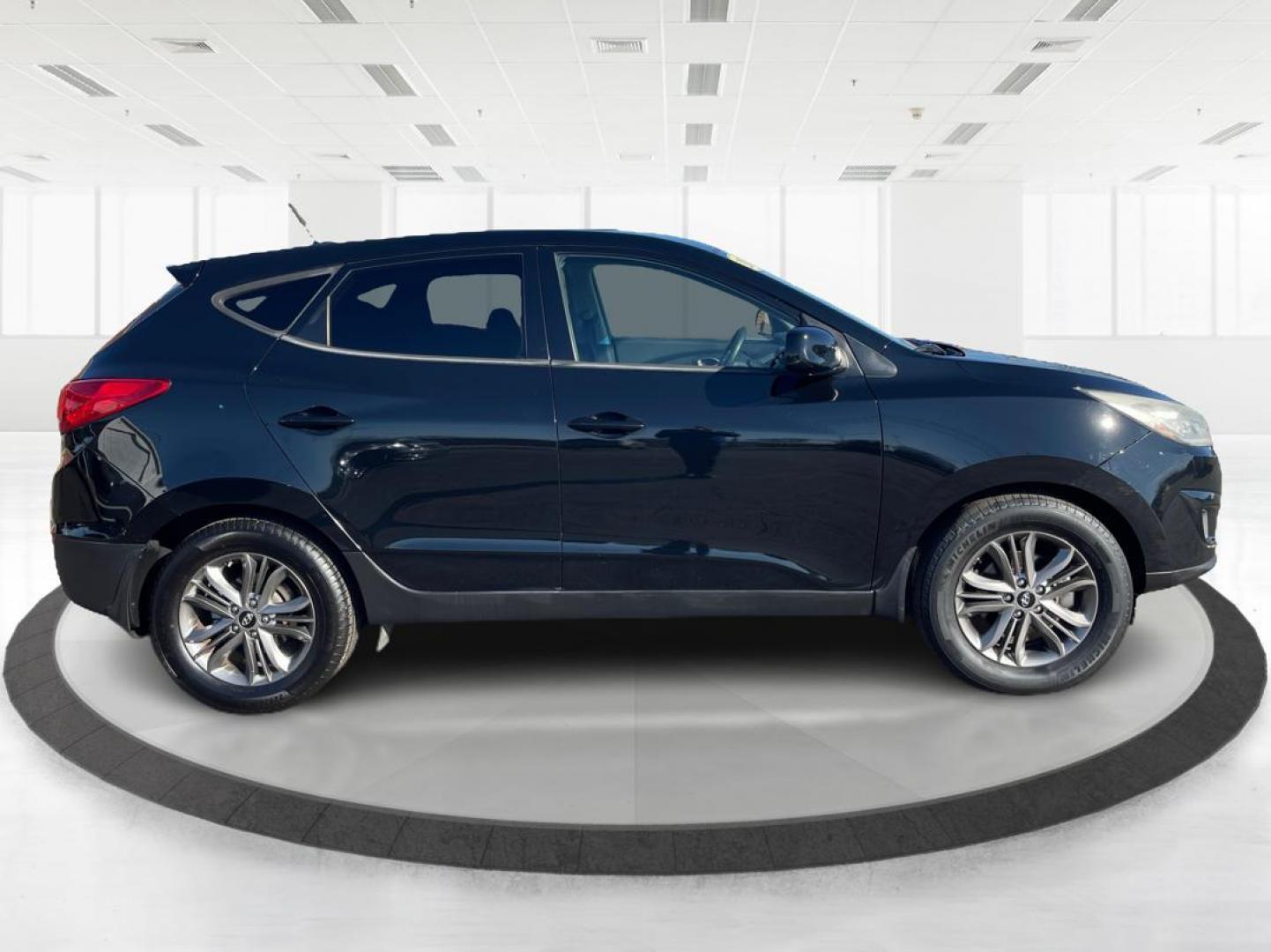 2014 Black Hyundai Tucson GL Auto AWD (KM8JTCAF0EU) with an 2.0L L4 DOHC 16V engine, 6-Speed Automatic transmission, located at 880 E. National Road, OH, 45377, (937) 908-9800, 39.891918, -84.183975 - Photo#1