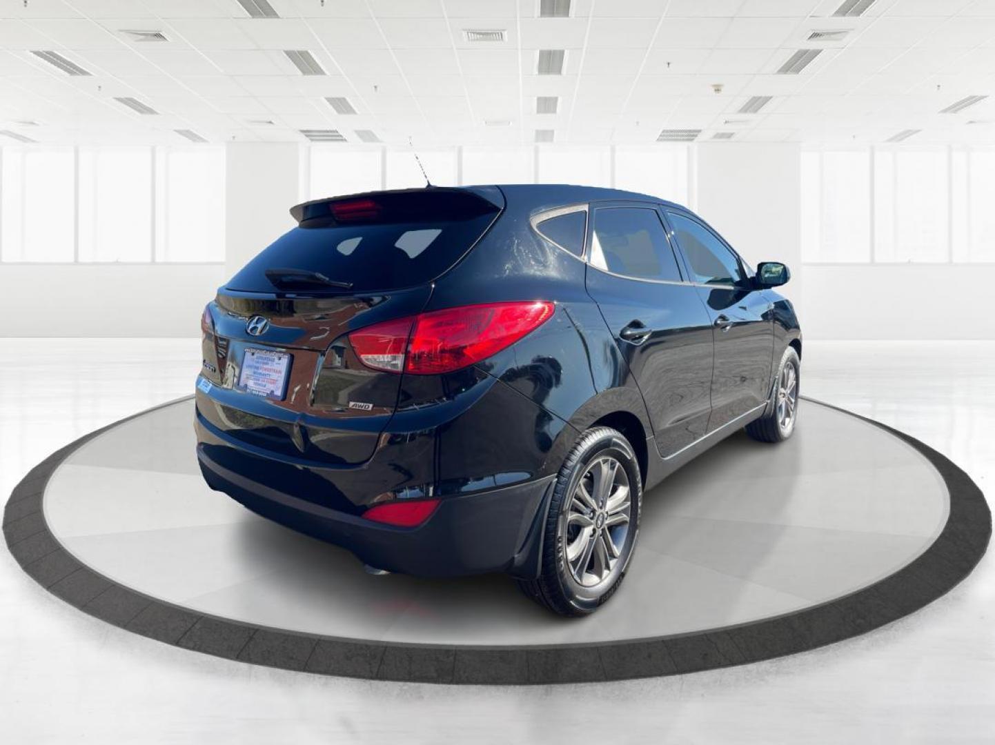 2014 Black Hyundai Tucson GL Auto AWD (KM8JTCAF0EU) with an 2.0L L4 DOHC 16V engine, 6-Speed Automatic transmission, located at 880 E. National Road, OH, 45377, (937) 908-9800, 39.891918, -84.183975 - Photo#2