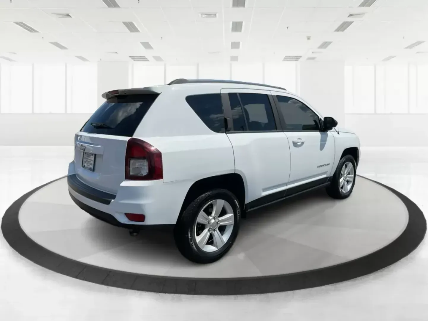 2014 Jeep Compass Sport (1C4NJDBB6ED) with an 2.4L I-4 DOHC engine, located at 401 Woodman Dr, Riverside, OH, 45431, (937) 908-9800, 39.761024, -84.120956 - Photo#2