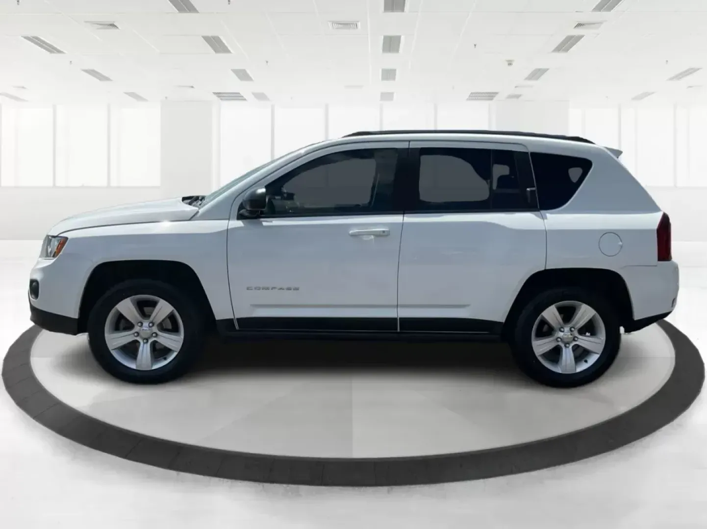 2014 Jeep Compass Sport (1C4NJDBB6ED) with an 2.4L I-4 DOHC engine, located at 401 Woodman Dr, Riverside, OH, 45431, (937) 908-9800, 39.761024, -84.120956 - Photo#5