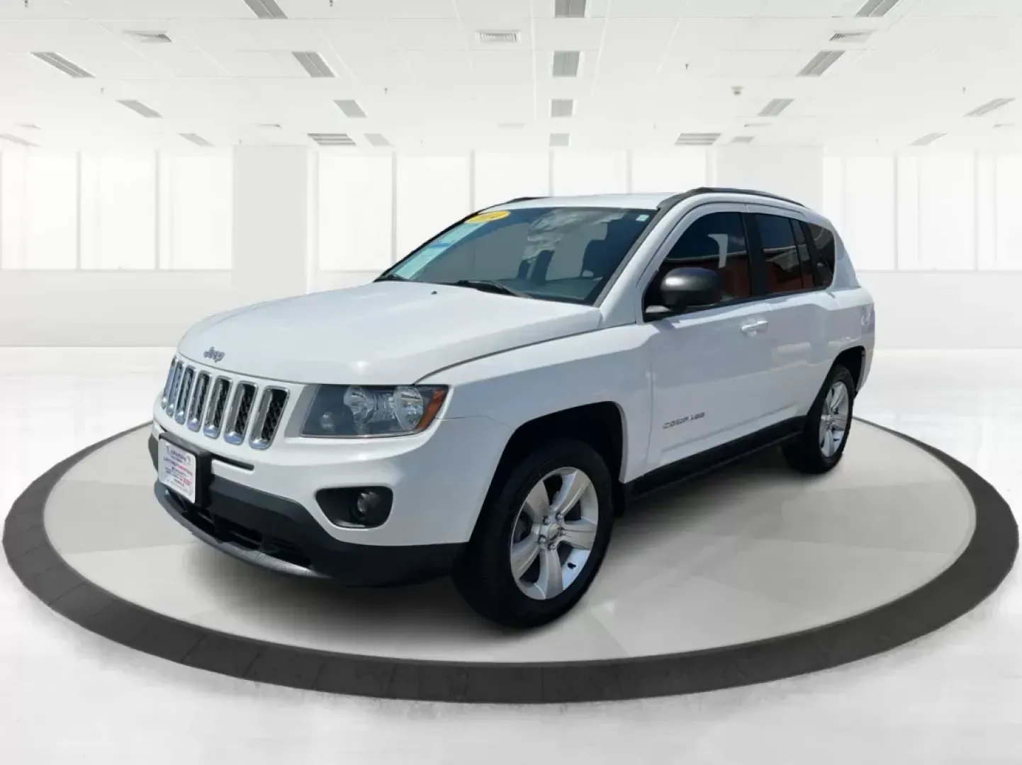 2014 Jeep Compass Sport (1C4NJDBB6ED) with an 2.4L I-4 DOHC engine, located at 401 Woodman Dr, Riverside, OH, 45431, (937) 908-9800, 39.761024, -84.120956 - Photo#7