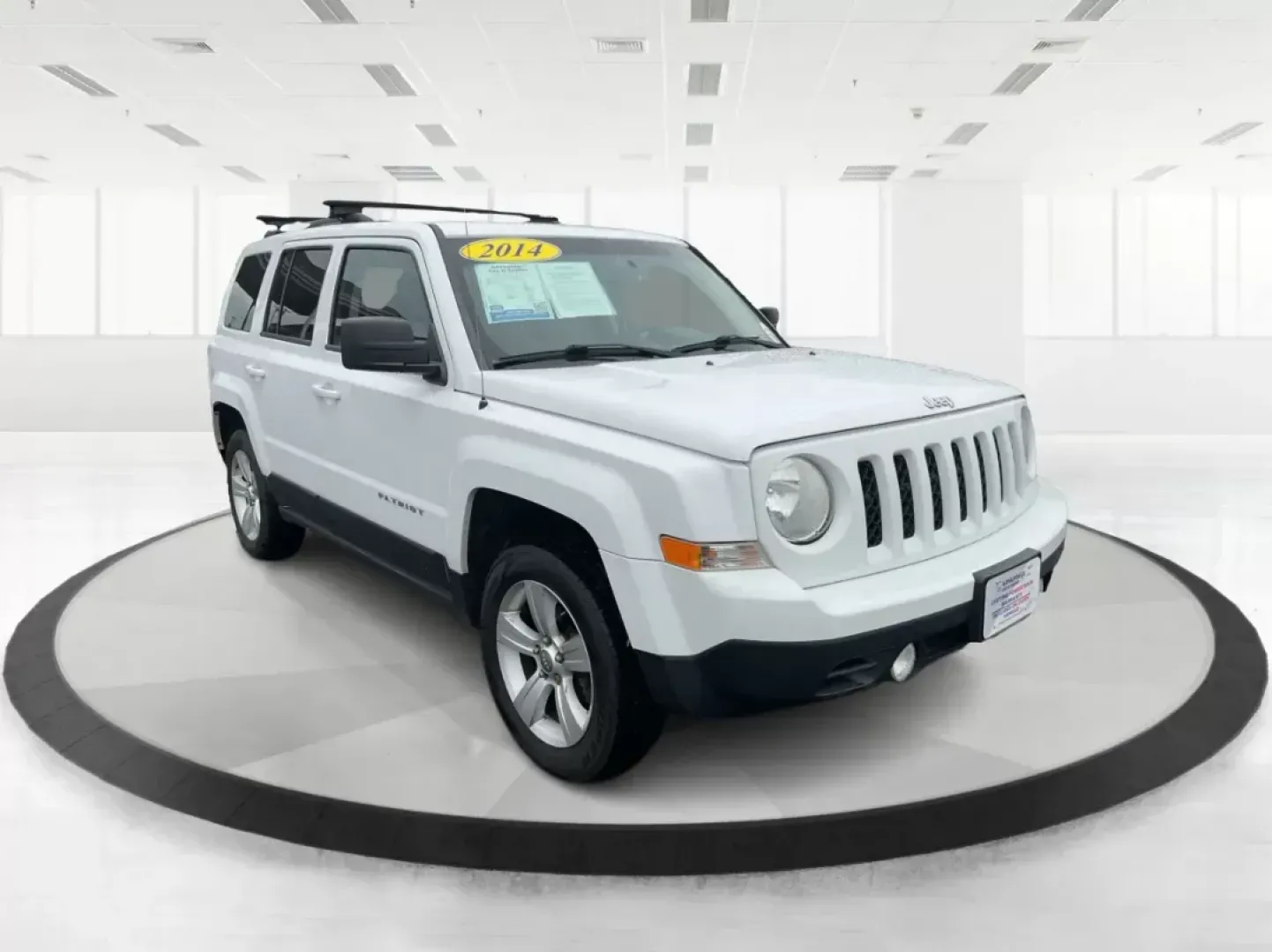 2014 Jeep Patriot Latitude (1C4NJRFB4ED) with an 2.4L I-4 DOHC engine, located at 880 E. National Road, OH, 45377, (937) 908-9800, 39.891918, -84.183975 - Photo#0