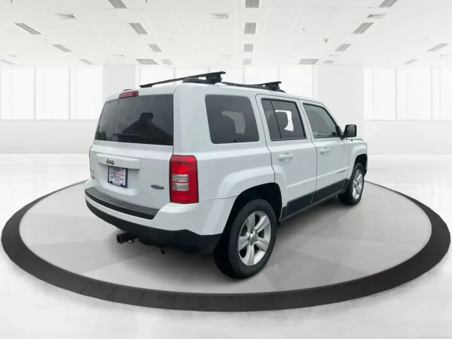 2014 Jeep Patriot Latitude (1C4NJRFB4ED) with an 2.4L I-4 DOHC engine, located at 880 E. National Road, OH, 45377, (937) 908-9800, 39.891918, -84.183975 - Photo#1