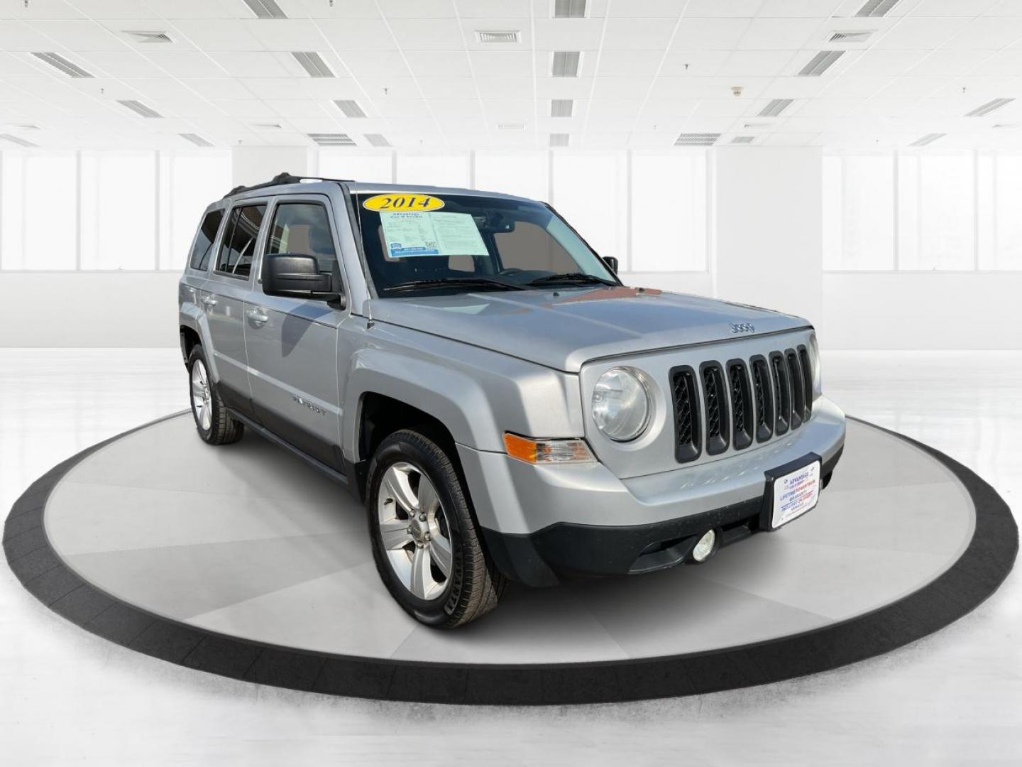 2014 Bright Silver Metallic CC Jeep Patriot Latitude 2WD (1C4NJPFA5ED) with an 2.0L L4 DOHC 16V engine, located at 1951 S Dayton Lakeview Rd., New Carlisle, OH, 45344, (937) 908-9800, 39.890999, -84.050255 - Photo#0