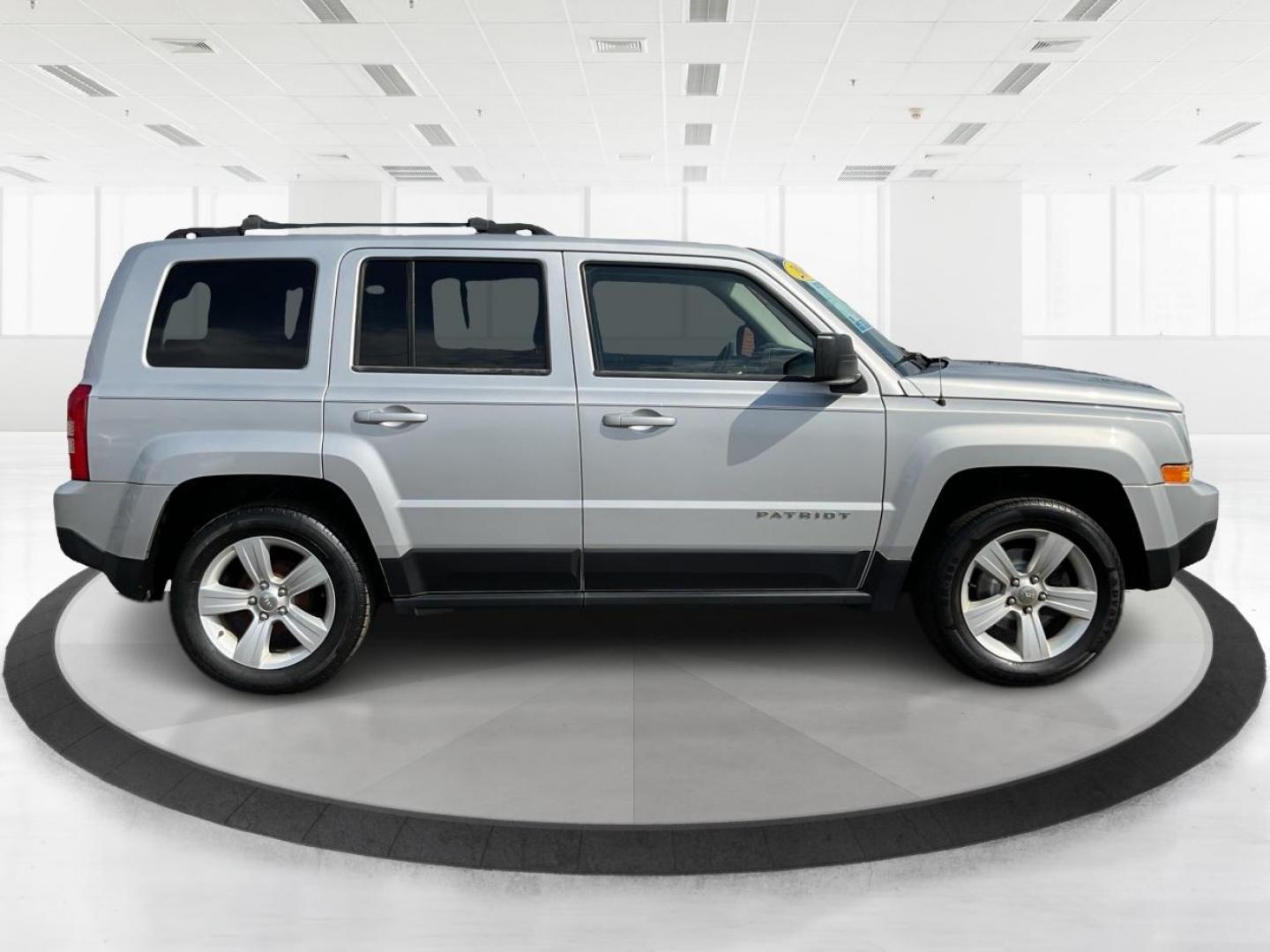 2014 Bright Silver Metallic CC Jeep Patriot Latitude 2WD (1C4NJPFA5ED) with an 2.0L L4 DOHC 16V engine, located at 1951 S Dayton Lakeview Rd., New Carlisle, OH, 45344, (937) 908-9800, 39.890999, -84.050255 - Photo#1