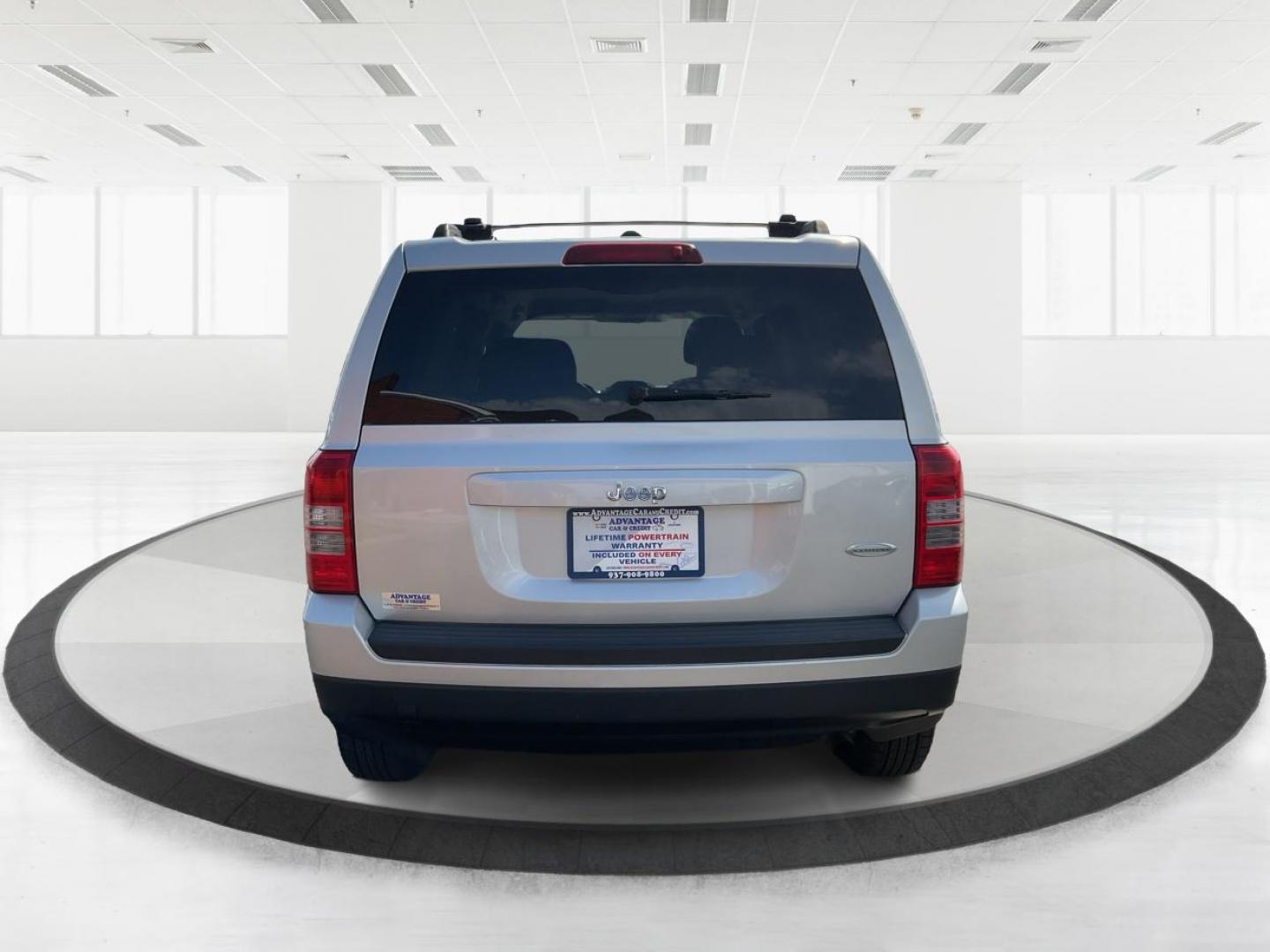 2014 Bright Silver Metallic CC Jeep Patriot Latitude 2WD (1C4NJPFA5ED) with an 2.0L L4 DOHC 16V engine, located at 1951 S Dayton Lakeview Rd., New Carlisle, OH, 45344, (937) 908-9800, 39.890999, -84.050255 - Photo#2