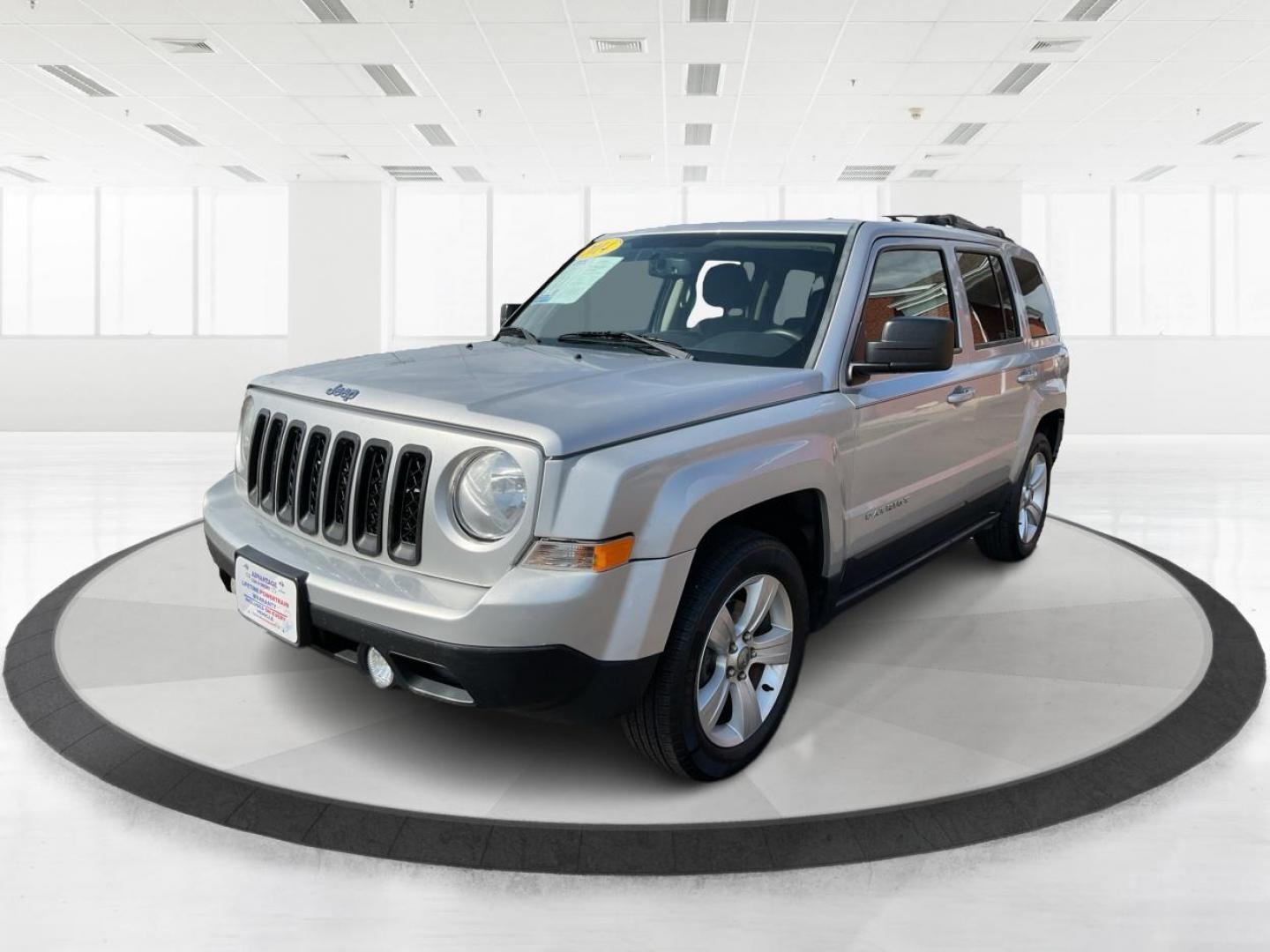 2014 Bright Silver Metallic CC Jeep Patriot Latitude 2WD (1C4NJPFA5ED) with an 2.0L L4 DOHC 16V engine, located at 1951 S Dayton Lakeview Rd., New Carlisle, OH, 45344, (937) 908-9800, 39.890999, -84.050255 - Photo#5