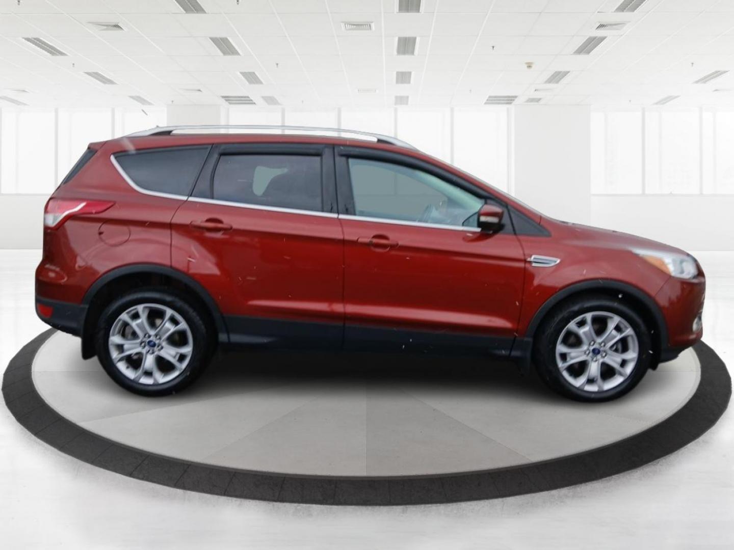 2015 Ford Escape Titanium 4WD (1FMCU9J92FU) with an 2.0L L4 DOHC 16V engine, 6-Speed Automatic transmission, located at 1230 East Main St, Xenia, OH, 45385, (937) 908-9800, 39.688042, -83.910538 - Photo#1
