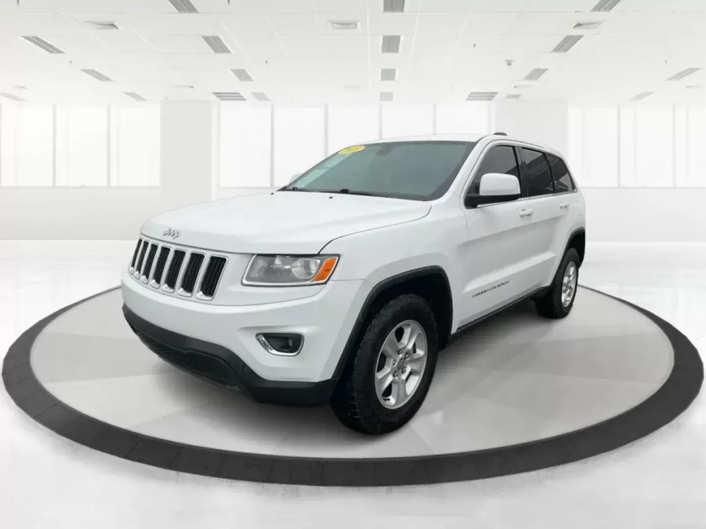 2015 Jeep Grand Cherokee Laredo (1C4RJFAG7FC) with an 3.6L V-6 DOHC engine, located at 8750 N County Rd 25A, Piqua, OH, 45356, (937) 908-9800, 40.164391, -84.232513 - Photo#7
