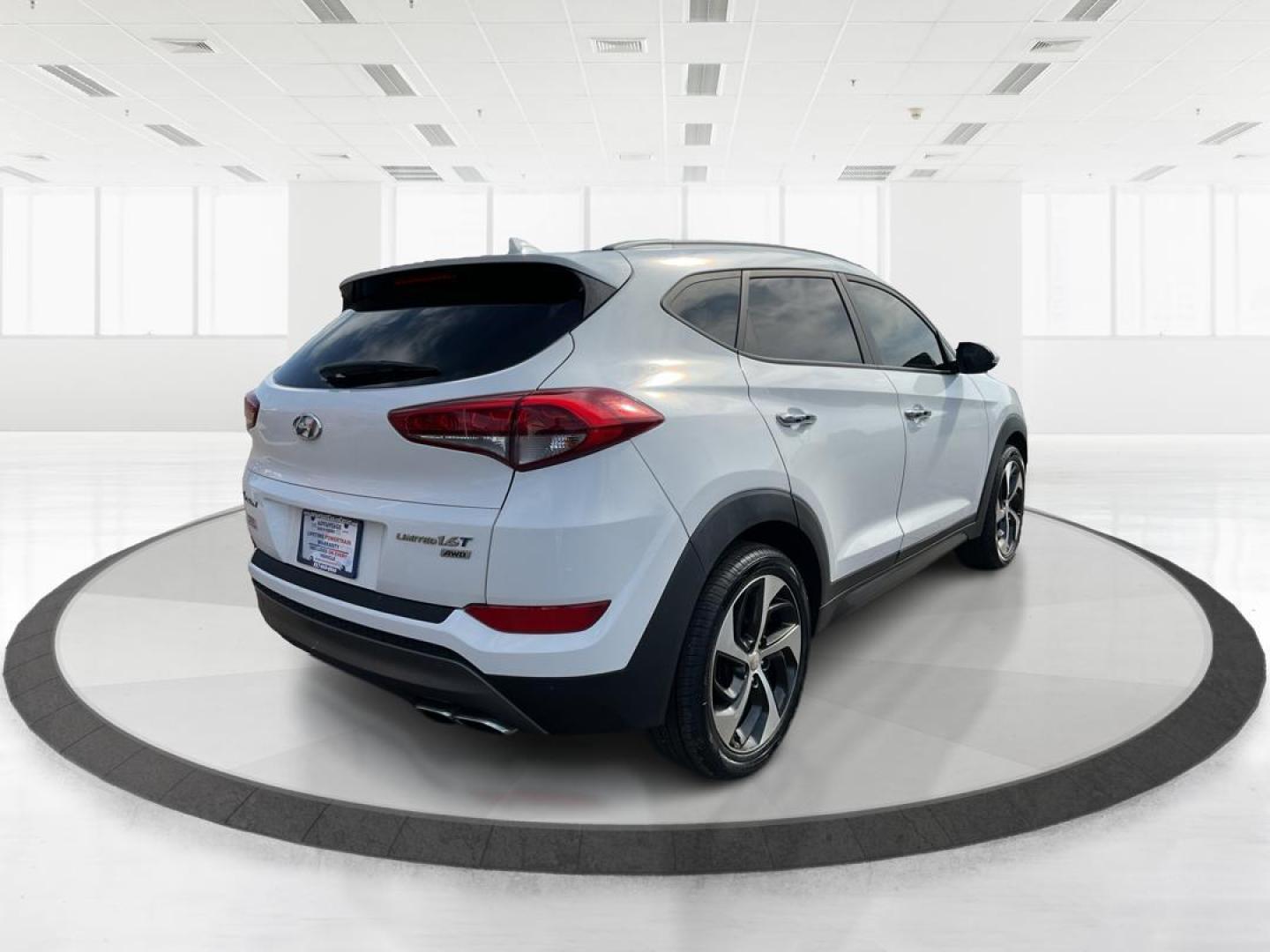 2016 Hyundai Tucson Limited (KM8J3CA20GU) with an 1.6L I-4 gasoline direct injection engine, located at 1099 N County Rd 25A , Troy, OH, 45373, (937) 908-9800, 40.057041, -84.215462 - Photo#2