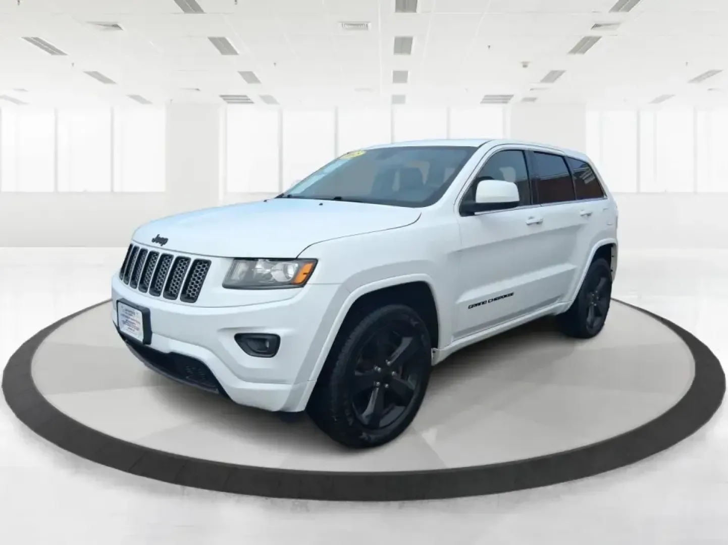 2015 Jeep Grand Cherokee Altitude (1C4RJFAG9FC) with an 3.6L V-6 DOHC engine, 8-Speed Automatic transmission, located at 1099 N County Rd 25A , Troy, OH, 45373, (937) 908-9800, 40.057079, -84.212883 - Weekend getaways to Hocking Hills, snowy school runs, or a confident daily commute up I75 feel easier when your SUV is built for real Ohio weather and real-life schedules. This 2015 Jeep Grand Cherokee Altitude in Bright White Clearcoat is the kind of capable, comfortable SUV that fits busy families - Photo#8