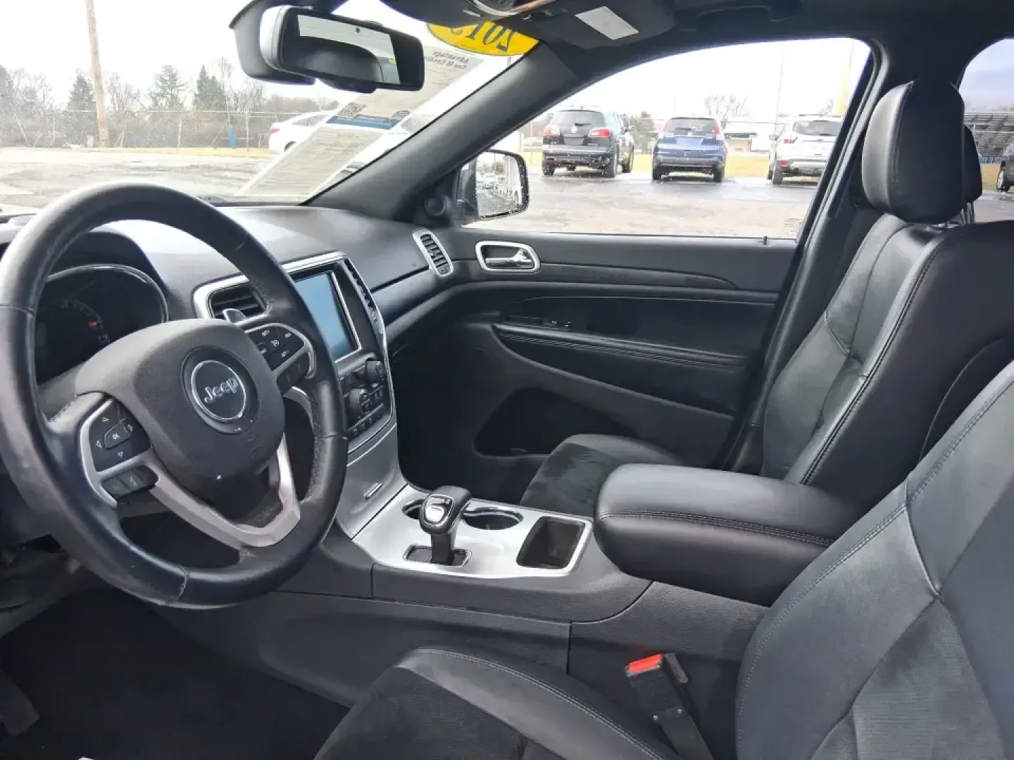 2015 Jeep Grand Cherokee Altitude (1C4RJFAG9FC) with an 3.6L V-6 DOHC engine, 8-Speed Automatic transmission, located at 1099 N County Rd 25A , Troy, OH, 45373, (937) 908-9800, 40.057079, -84.212883 - Weekend getaways to Hocking Hills, snowy school runs, or a confident daily commute up I75 feel easier when your SUV is built for real Ohio weather and real-life schedules. This 2015 Jeep Grand Cherokee Altitude in Bright White Clearcoat is the kind of capable, comfortable SUV that fits busy families - Photo#9