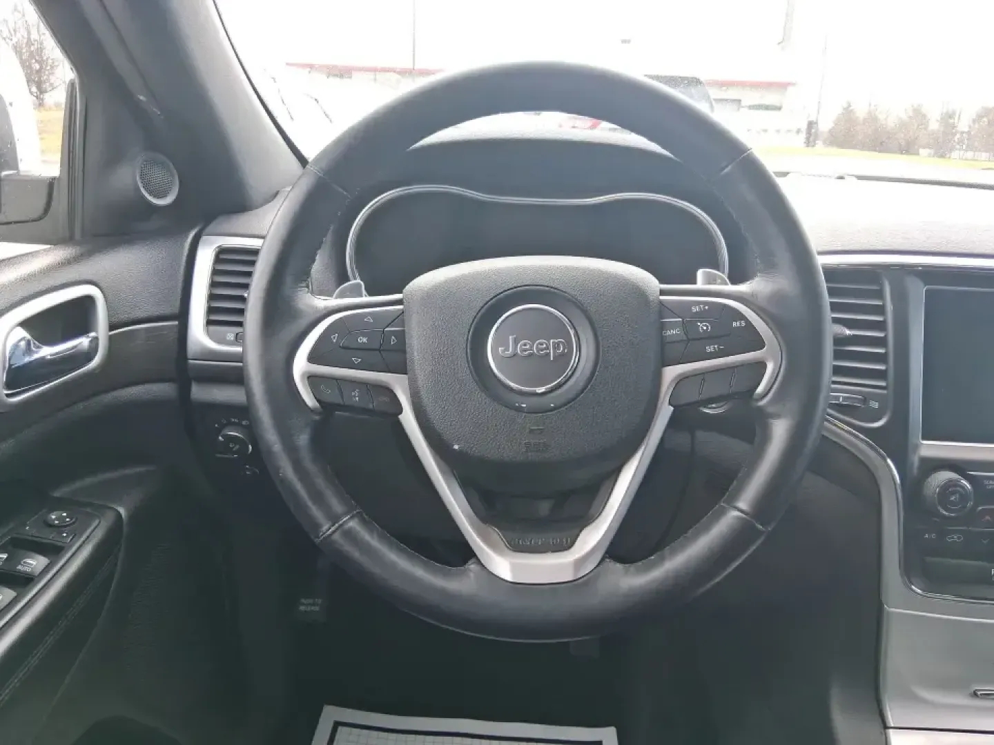 2015 Jeep Grand Cherokee Altitude (1C4RJFAG9FC) with an 3.6L V-6 DOHC engine, 8-Speed Automatic transmission, located at 1099 N County Rd 25A , Troy, OH, 45373, (937) 908-9800, 40.057079, -84.212883 - Weekend getaways to Hocking Hills, snowy school runs, or a confident daily commute up I75 feel easier when your SUV is built for real Ohio weather and real-life schedules. This 2015 Jeep Grand Cherokee Altitude in Bright White Clearcoat is the kind of capable, comfortable SUV that fits busy families - Photo#16