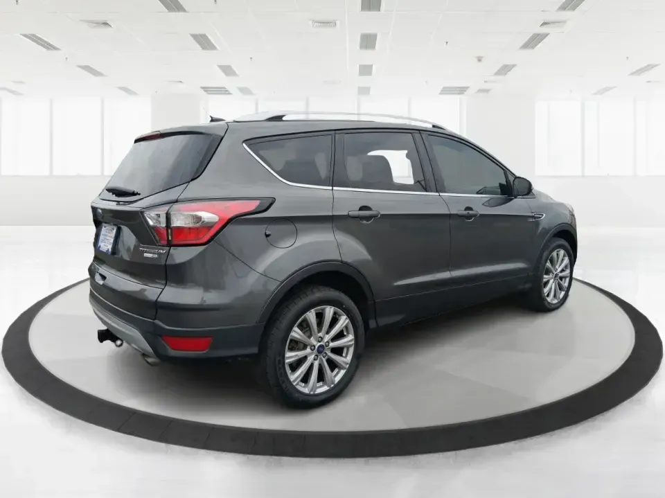 2017 Ford Escape Titanium (1FMCU9J94HU) with an 2.0L L4 DOHC 16V engine, 6A transmission, located at 1951 S Dayton Lakeview Rd., New Carlisle, OH, 45344, (937) 908-9800, 39.890999, -84.050255 - Pack the gear, load up the family, and point the GPS toward your next weekend escape-this 2017 Ford Escape Titanium is the kind of compact SUV that fits real life in Piqua. Whether you're commuting up I75, running errands along N County Rd 25A, or planning a day trip to Lock 9 Park and the Great Mia - Photo#2