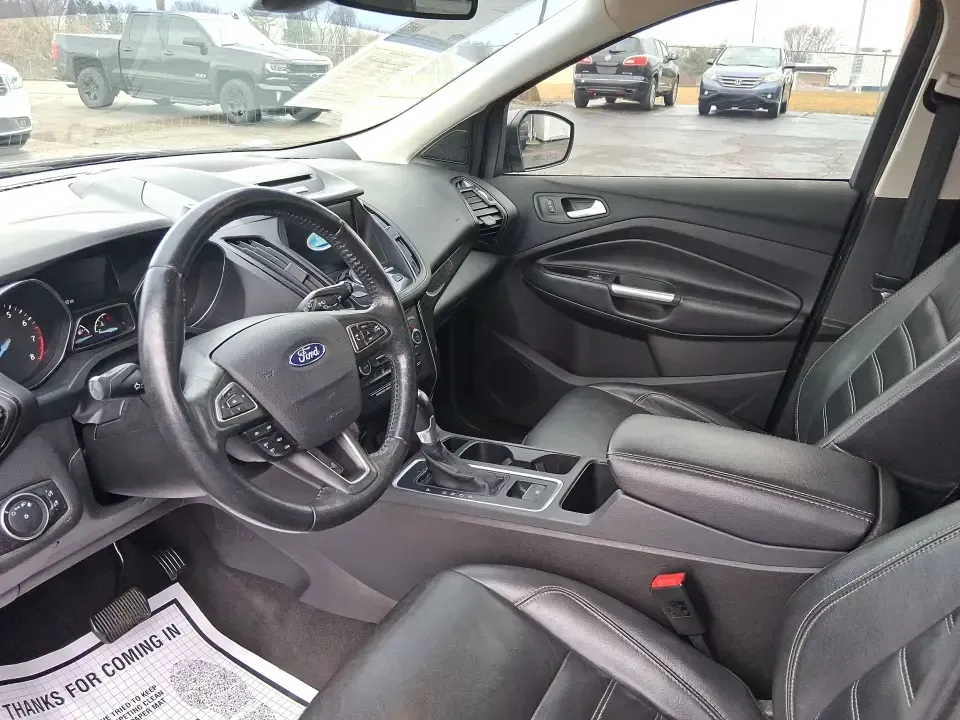 2017 Ford Escape Titanium (1FMCU9J94HU) with an 2.0L L4 DOHC 16V engine, 6A transmission, located at 1951 S Dayton Lakeview Rd., New Carlisle, OH, 45344, (937) 908-9800, 39.890999, -84.050255 - Pack the gear, load up the family, and point the GPS toward your next weekend escape-this 2017 Ford Escape Titanium is the kind of compact SUV that fits real life in Piqua. Whether you're commuting up I75, running errands along N County Rd 25A, or planning a day trip to Lock 9 Park and the Great Mia - Photo#9