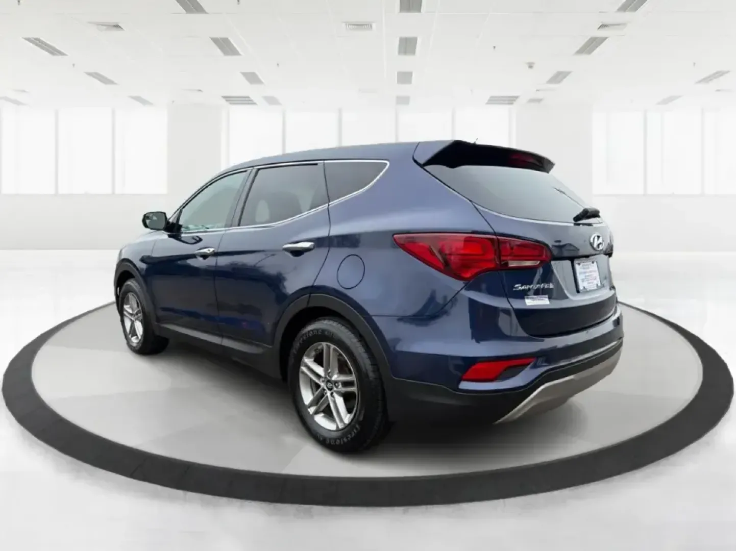 2018 Hyundai Santa Fe 2.4L (5XYZTDLB6JG) with an Theta II 2.4L I-4 gasoline direct injection engine, 6A transmission, located at 8750 N County Rd 25A, Piqua, OH, 45356, (937) 908-9800, 40.164391, -84.232513 - Road trips to Indian Lake, snowy school runs, and everyday commuting up and down I75 feel a lot easier when your SUV is roomy, confident in bad weather, and comfortable for everyone on board. This 2018 Hyundai Santa Fe 2.4L in striking Nightfall Blue is a practical, family-friendly sport utility tha - Photo#4