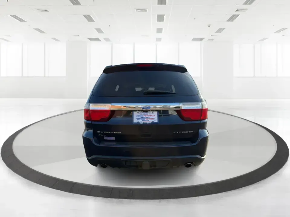 2013 Dodge Durango Citadel (1C4SDJET6DC) with an 5.7L V8 OHV 16V engine, 5-Speed Automatic transmission, located at 8750 N County Rd 25A, Piqua, OH, 45356, (937) 908-9800, 40.164391, -84.232513 - Need one SUV that can handle school drop-offs, I-75 commutes, and a loaded-up weekend trip to Indian Lake or a tailgate in Dayton-without giving up comfort or capability? This 2013 Dodge Durango Citadel in True Blue Pearlcoat is built for real-life Ohio driving, with confident 4WD/AWD traction, V8 p - Photo#3