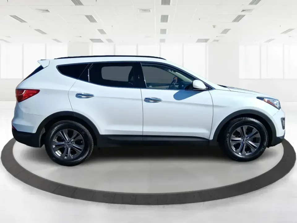 2013 Hyundai Santa Fe Sport (5XYZU3LB7DG) with an Theta II 2.4L I-4 gasoline direct injection engine, 6-Speed Automatic transmission, located at 880 E. National Road, Vandalia, OH, 45377, (937) 908-9800, 39.891918, -84.183594 - Need one SUV that can handle school drop-offs, I75 commutes, and a weekend escape to Taylorsville MetroPark without draining your budget? This 2013 Hyundai Santa Fe Sport is a smart, road-trip-ready crossover that blends everyday practicality with comfort features you'll appreciate on longer drives - Photo#1
