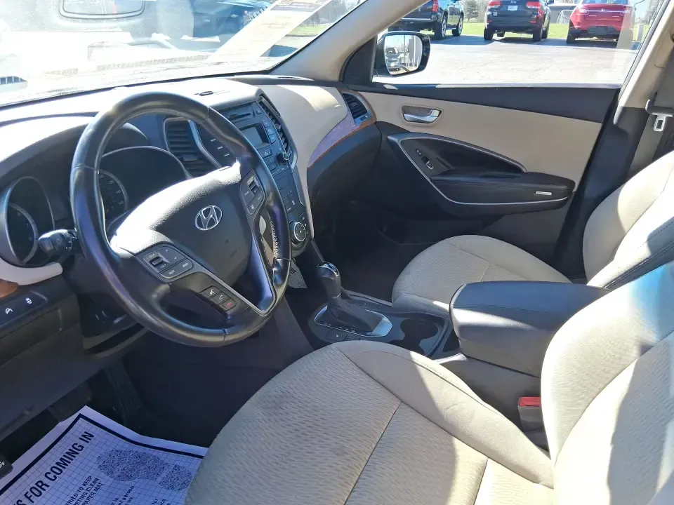 2013 Hyundai Santa Fe Sport (5XYZU3LB7DG) with an Theta II 2.4L I-4 gasoline direct injection engine, 6-Speed Automatic transmission, located at 880 E. National Road, Vandalia, OH, 45377, (937) 908-9800, 39.891918, -84.183594 - Need one SUV that can handle school drop-offs, I75 commutes, and a weekend escape to Taylorsville MetroPark without draining your budget? This 2013 Hyundai Santa Fe Sport is a smart, road-trip-ready crossover that blends everyday practicality with comfort features you'll appreciate on longer drives - Photo#9